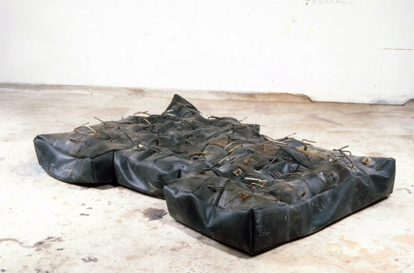 Blow-Up Mattress 1996 rubber and brass 96 X 48 X 9"