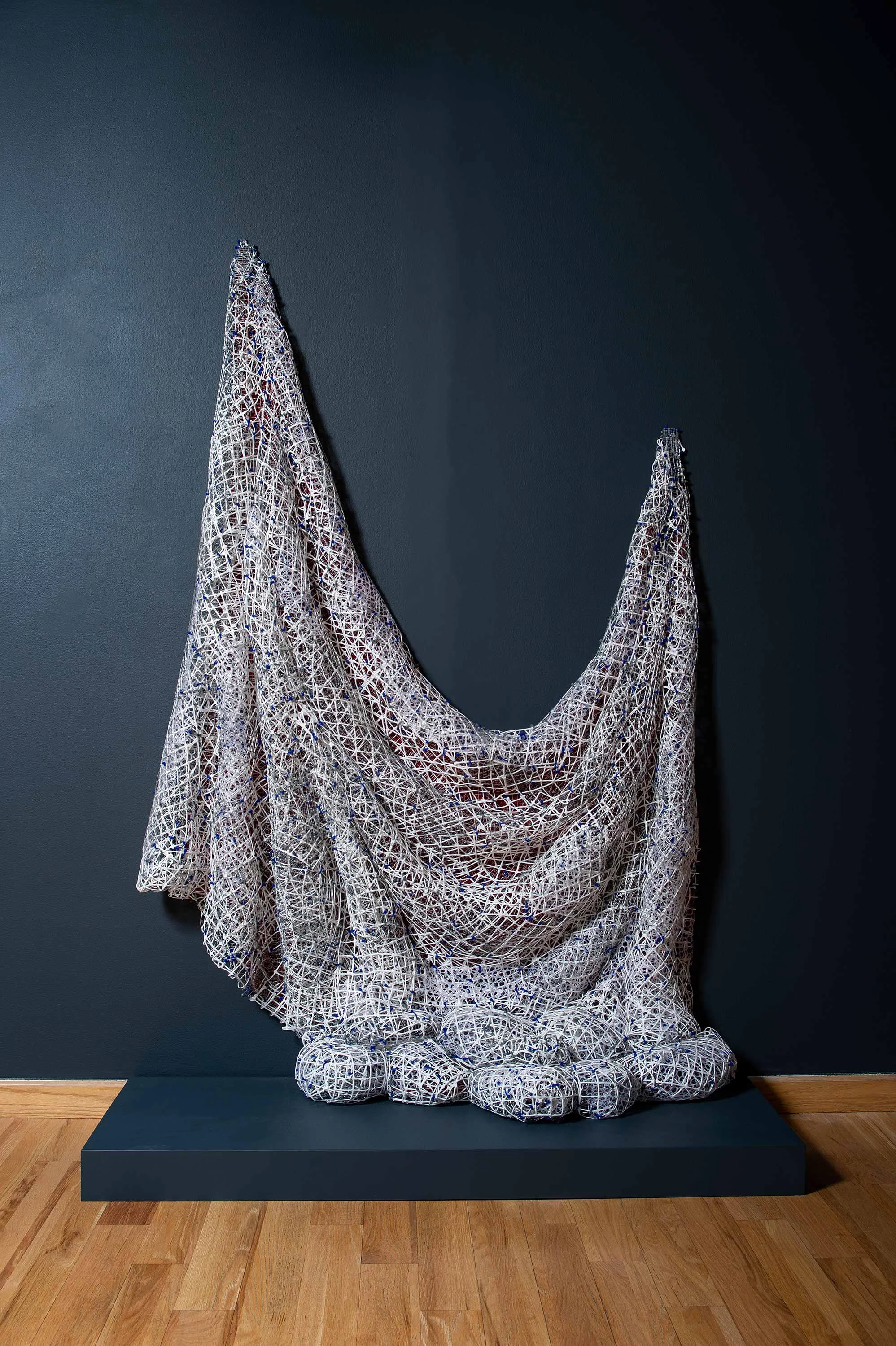 Red_White Drape Drip 2018 plastic and metal fencing 88 X 58 X 24”