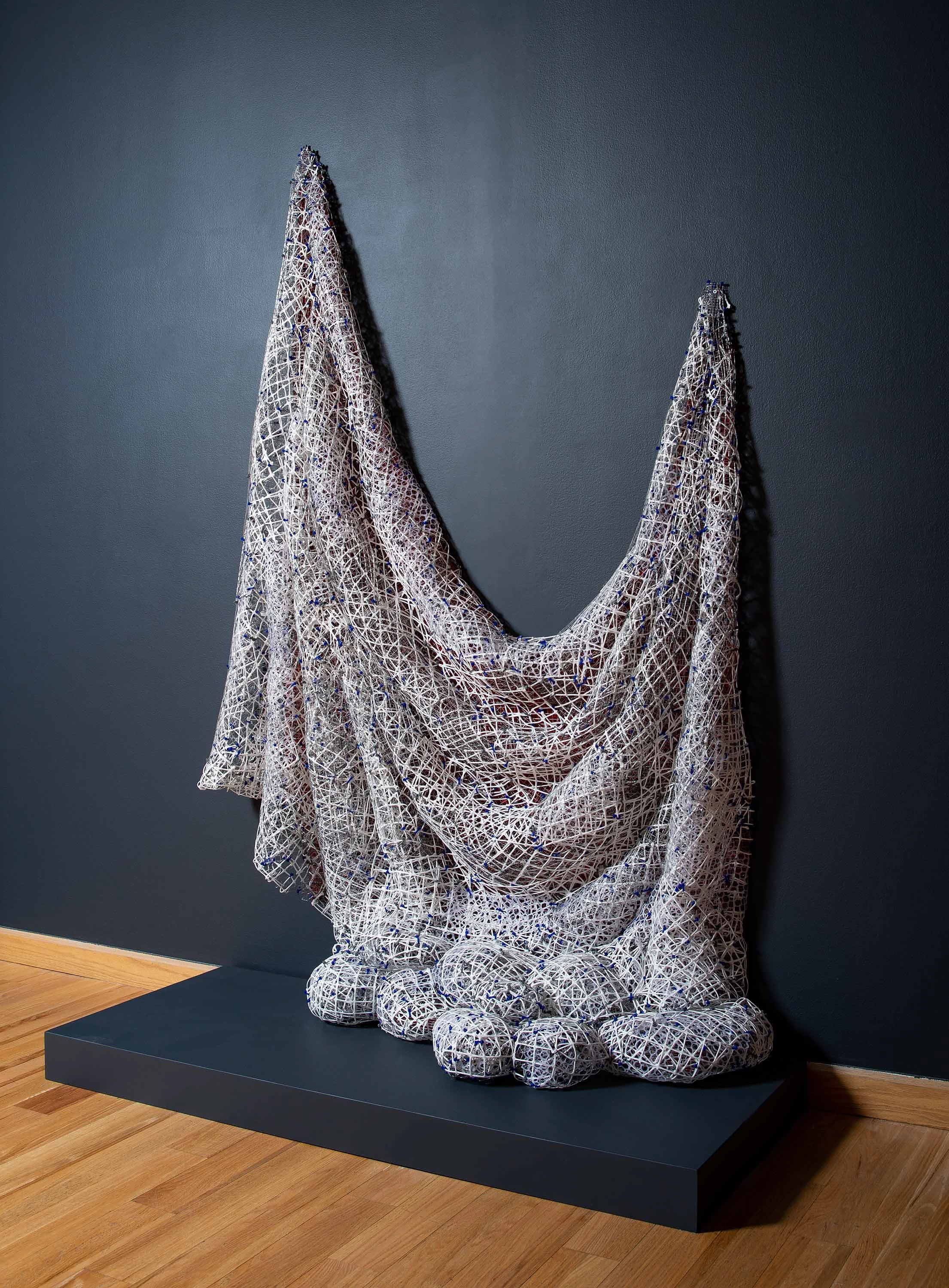 Red_White Drape Drip 2018 plastic and metal fencing 88 X 58 X 24”