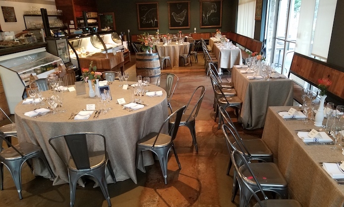 A seated dinner at Revival Market. The market is closed evenings, making it a great spot for on-site events. 