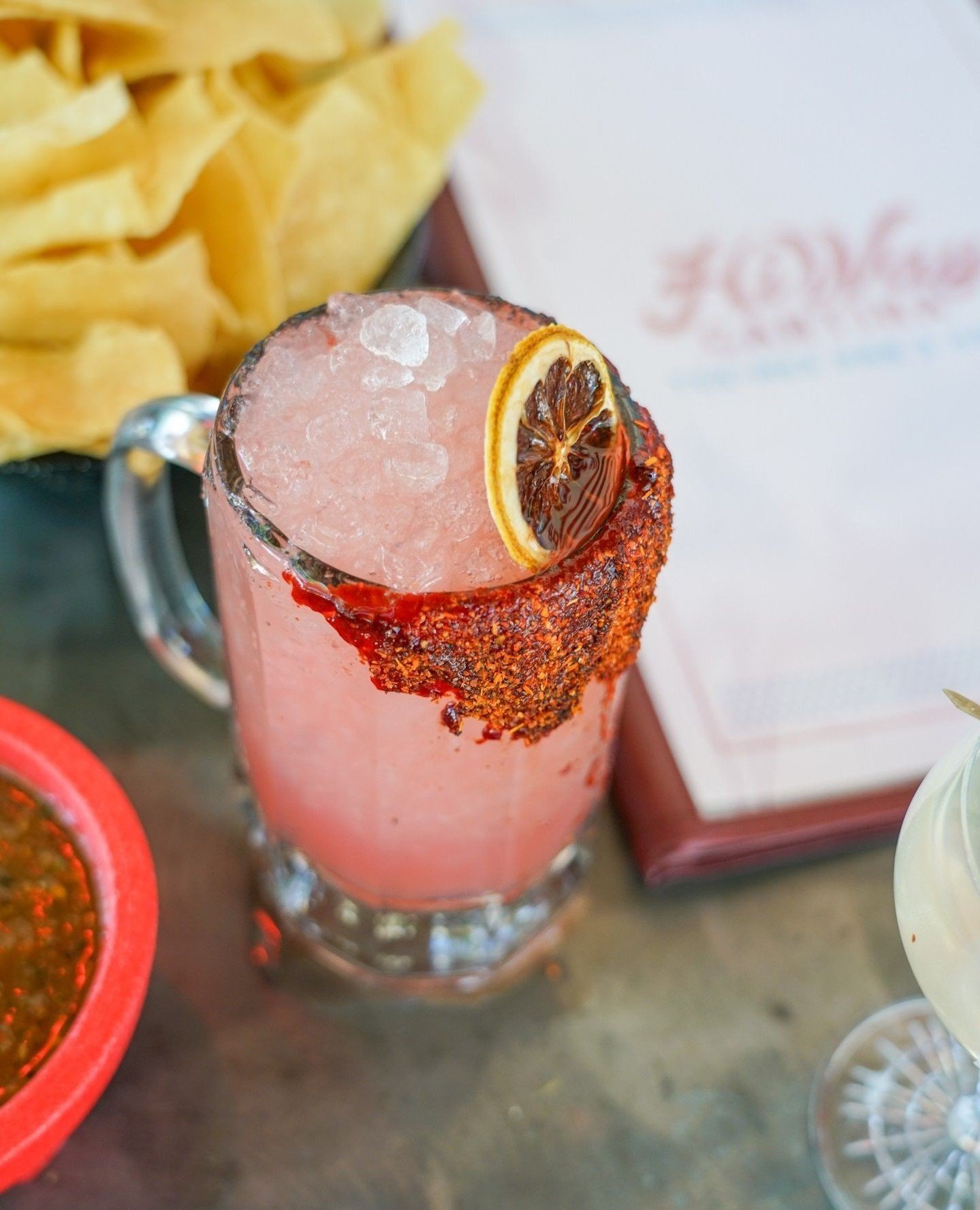 It's refreshing, it's vibrant, it's the Watermelon Mezcal Margarita made up of @mezcalamaras, @marfaspiritco orange liqueur, fresh lime, watermelon, hibiscus and @tajinusa. Sip on this and round out your weekend with #HiWayCantina.