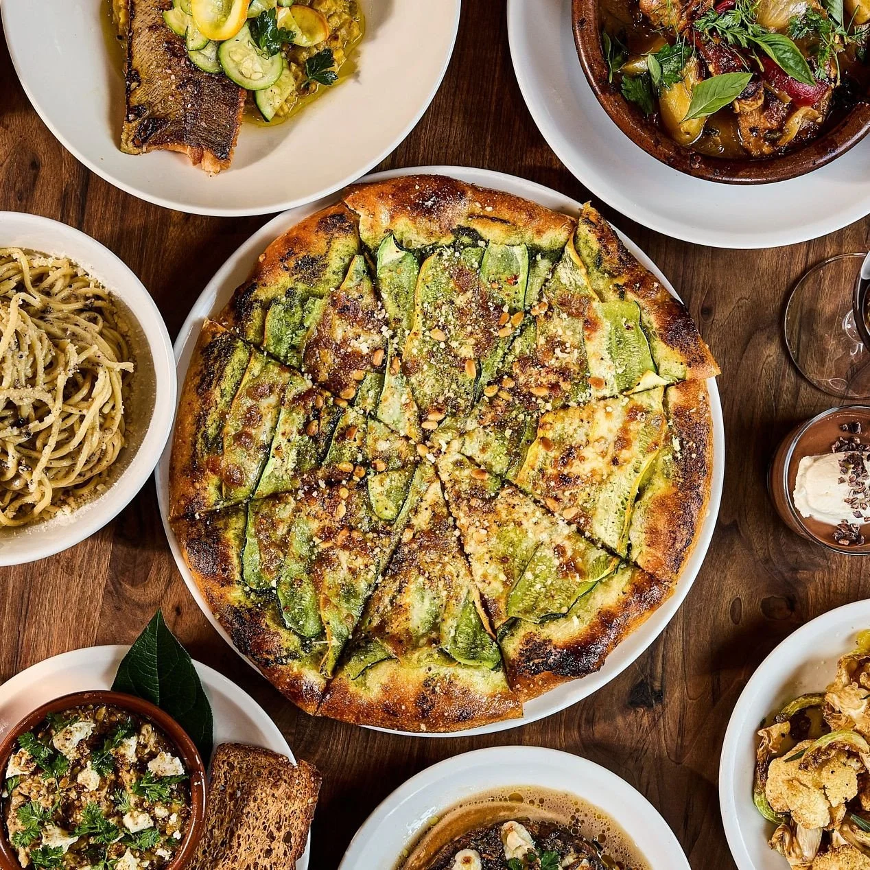 More signs of summer have arrived. Back on the menu:⁠
⁠
🌿 Local squash pizza with basil pesto, smoked mozzarella, pine nuts, and parm⁠
🌿 Zucchini &amp; cucumber carpaccio with spring onion, Sapore del Piave, hazelnuts, herbs, and vinaigrette