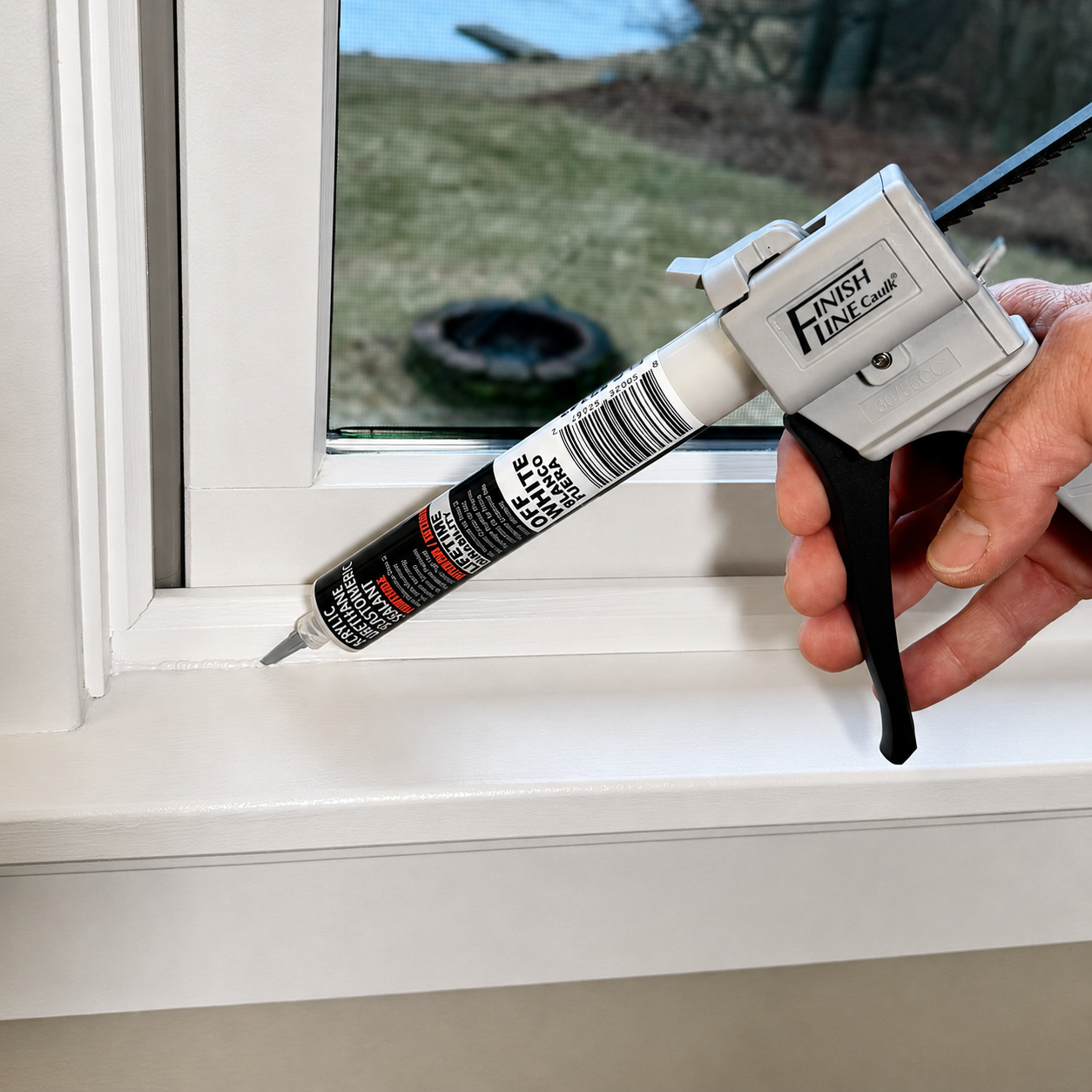 Finish Line Caulk 55 mL hand dispenser applying sealant around interior window trim for a clean, controlled bead.