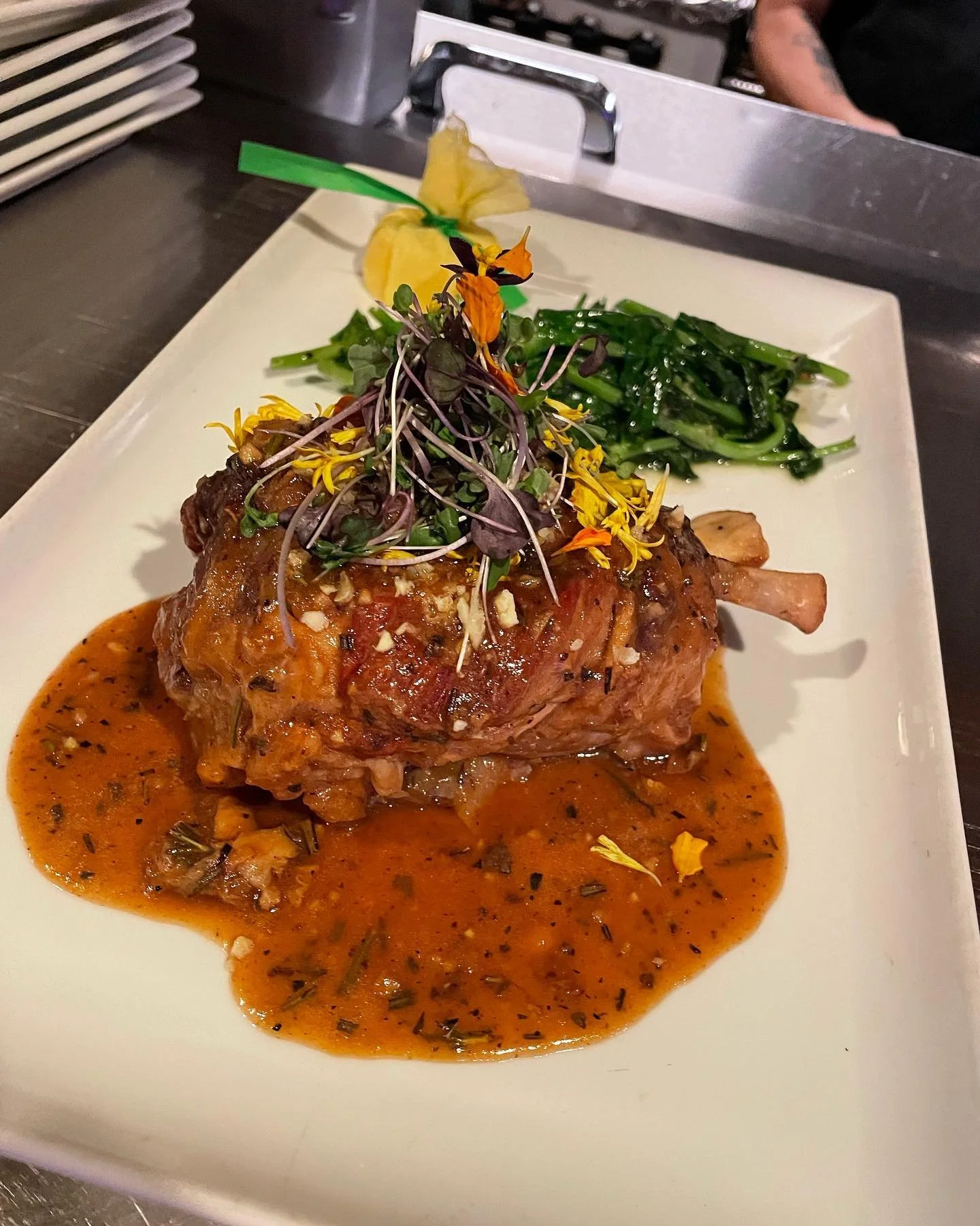Slow roasted pork shank with an apple, lemon reduction and saut&eacute;ed pea vibes.

#italianfood #ciboitaliano #baroloristoranteseattle #baroloristorante #seattlefood #seattlerestaurants #slowroasted #porkshank #peavines
