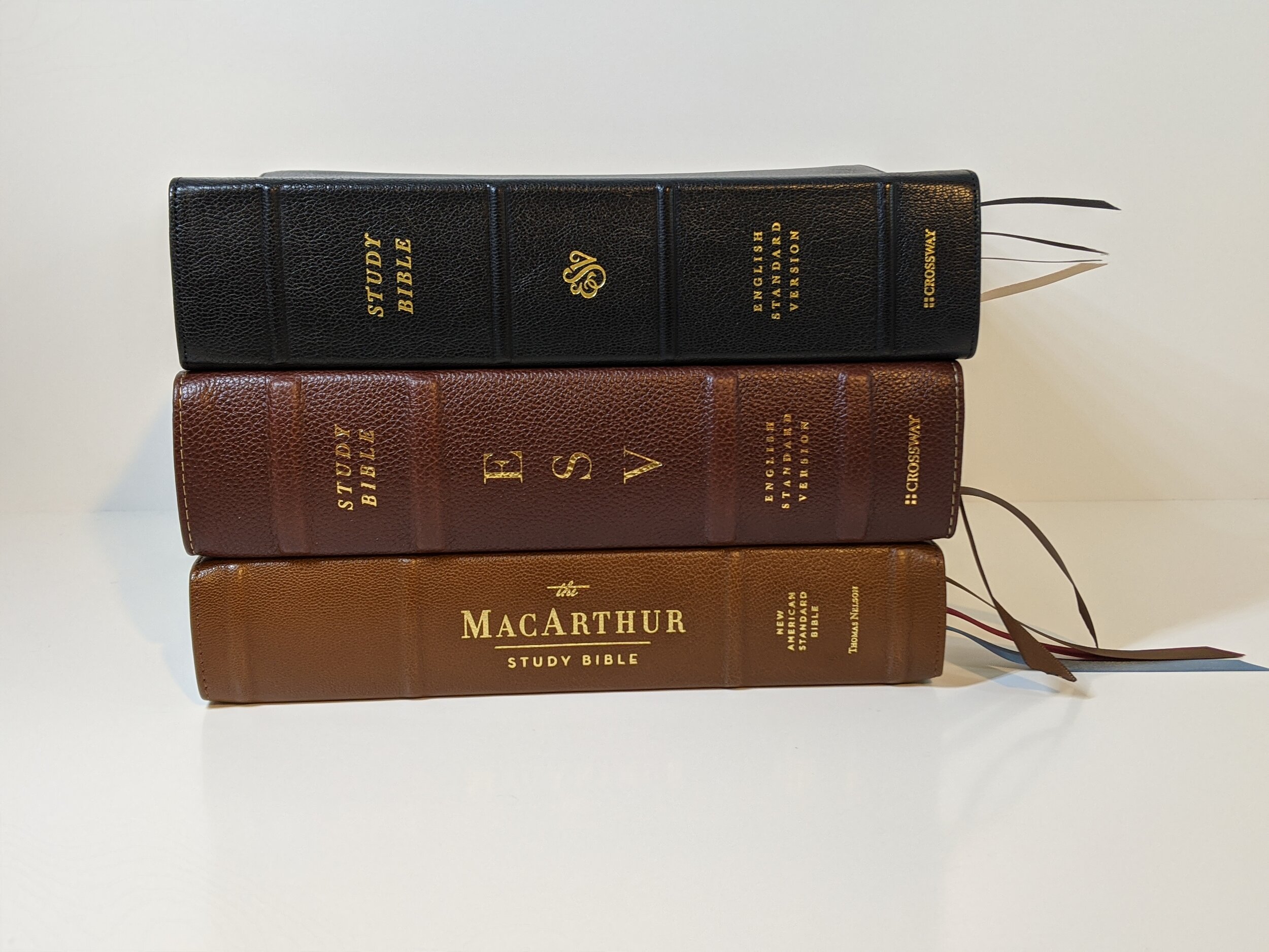  top to bottom: ESV Heirloom Study Bible, ESV Study Bible in brown Cowhide, NASB  Premier Collection MacArthur Study Bible 