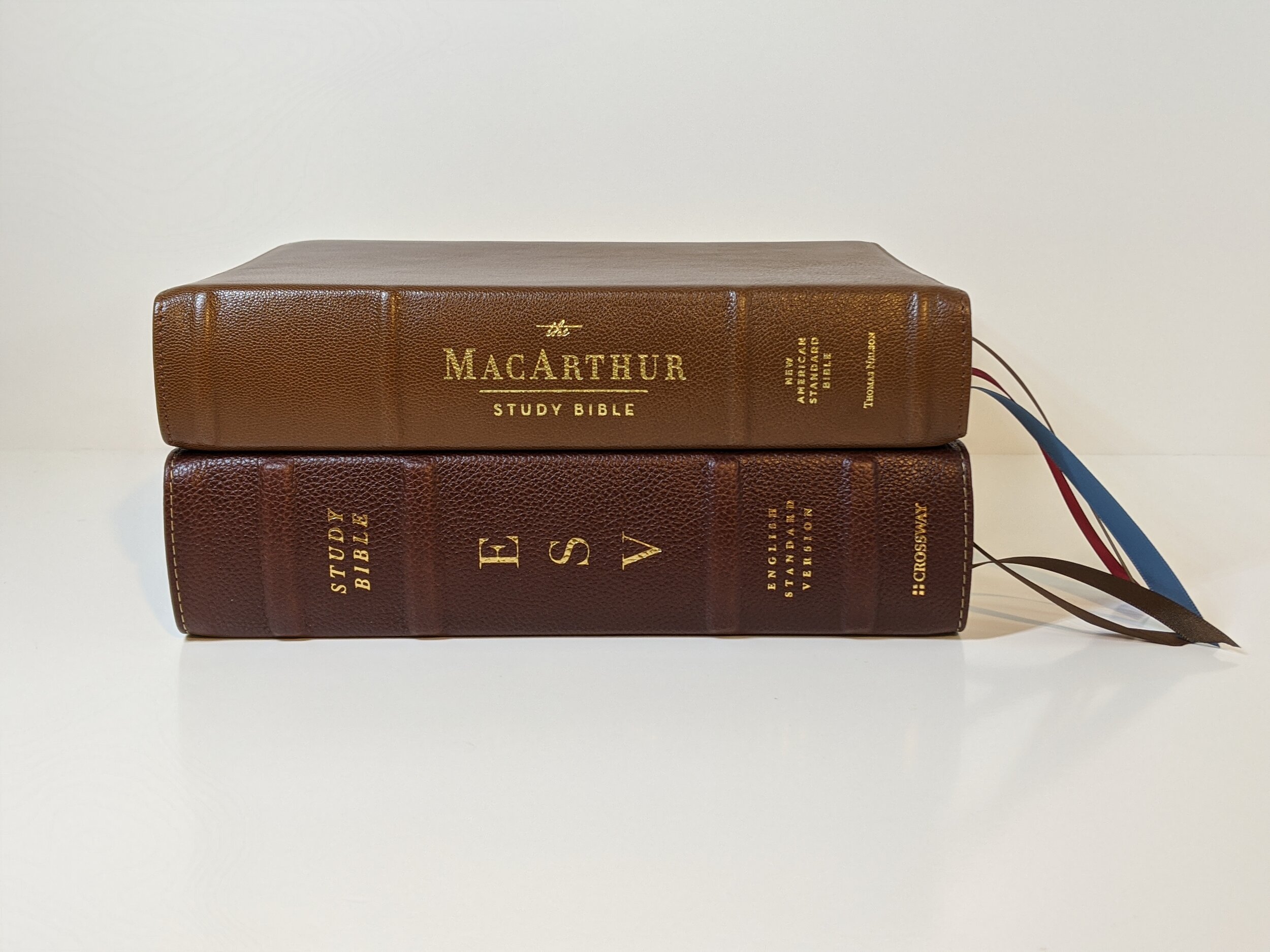  top: NASB Premier Collection MacArthur Study Bible bottom: ESV Study Bible in brown Cowhide 