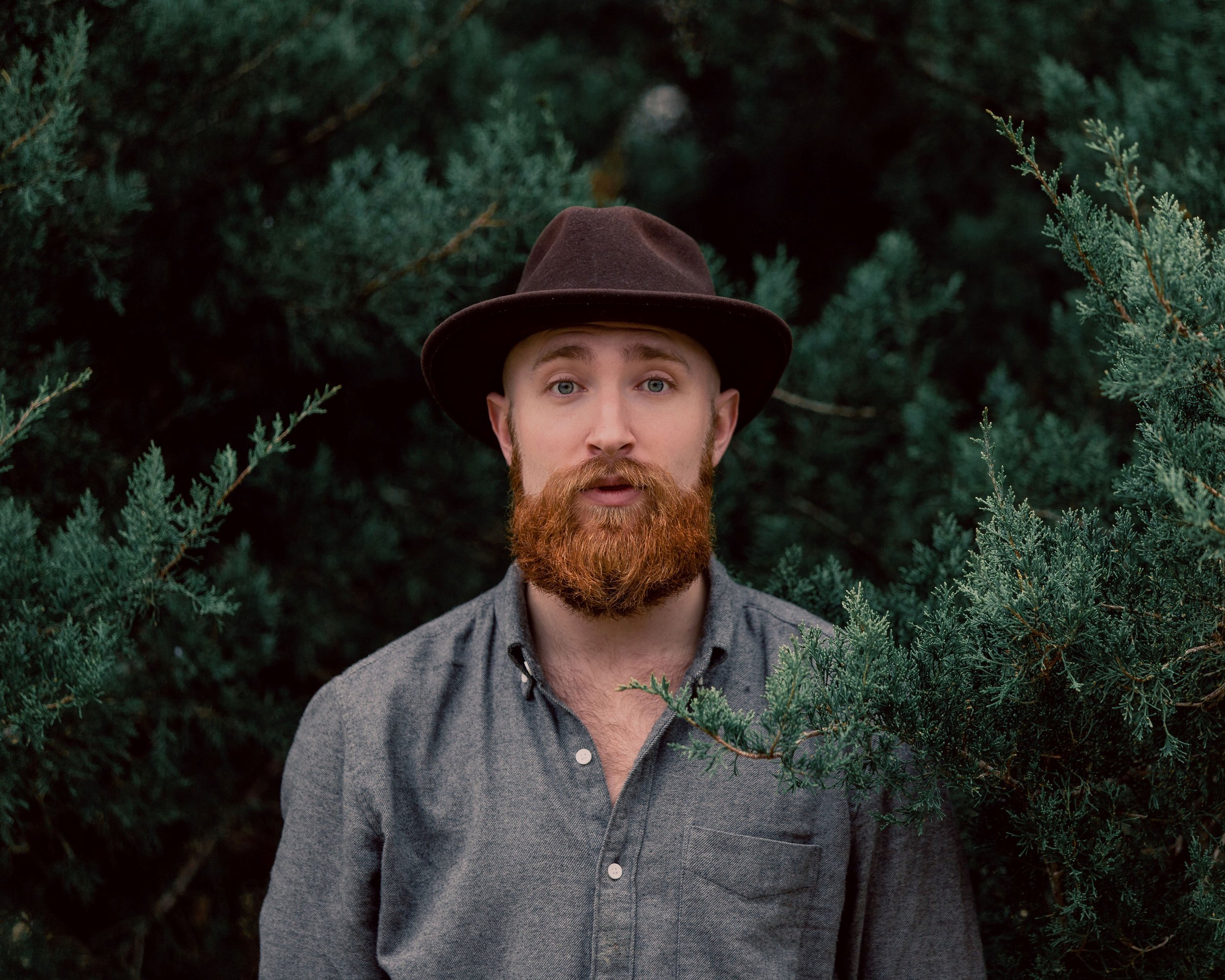 shafer shot fedora lips apart greenery.jpg