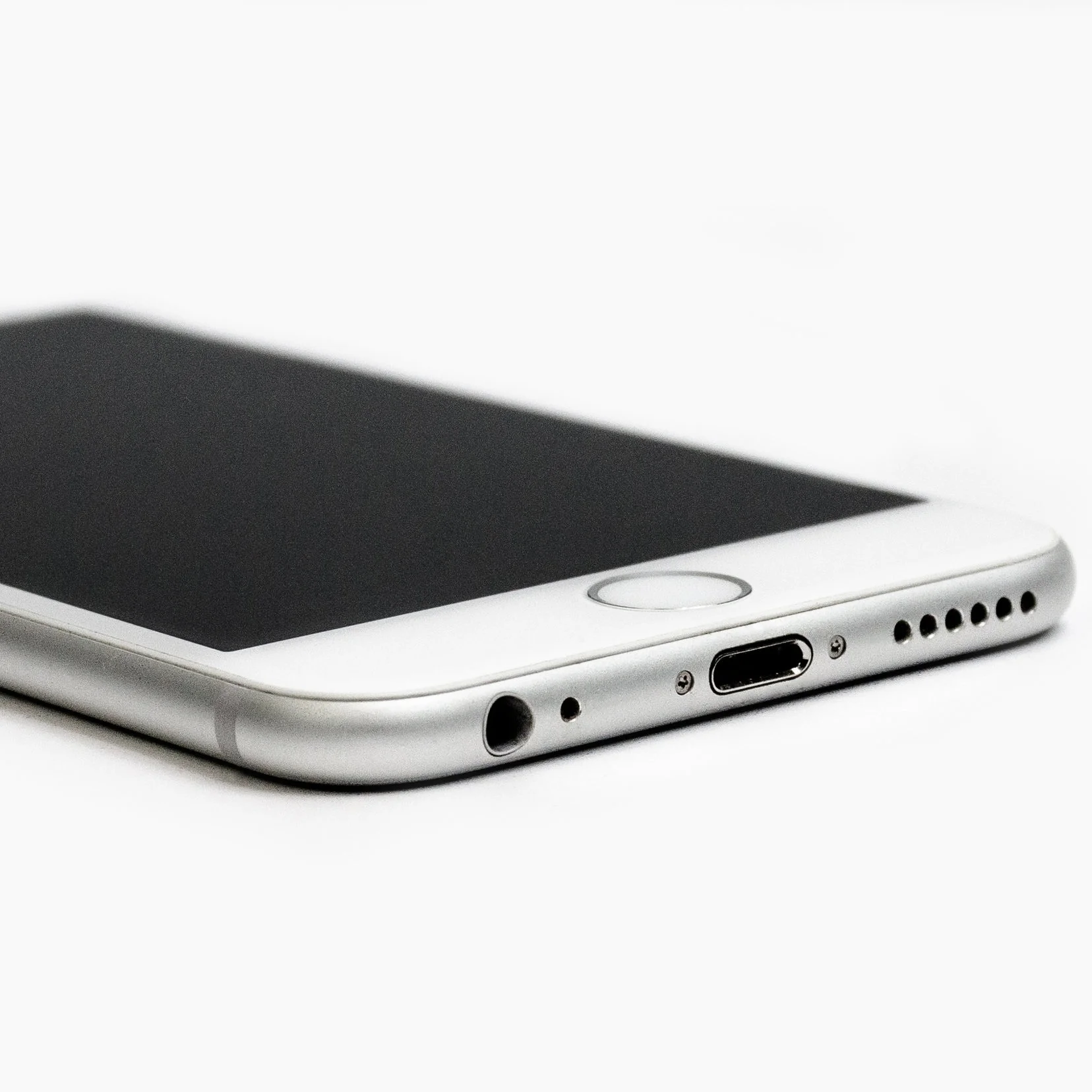 Canva+-+Close-up+of+Mobile+Phone+Against+White+Background.jpg