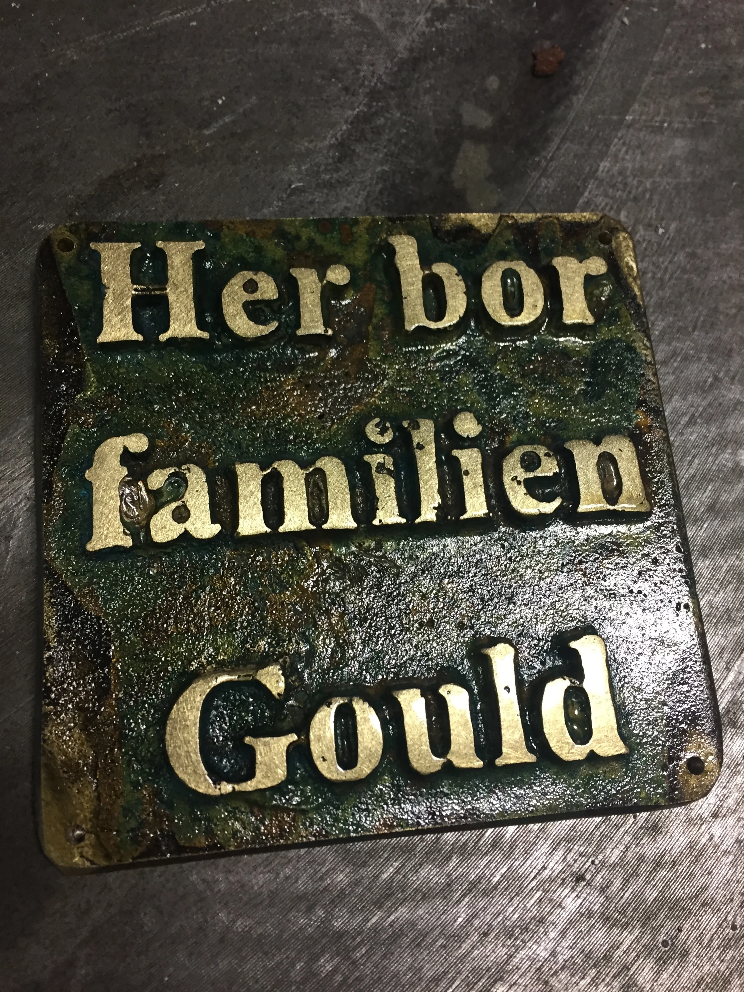 Door sing, cast brass