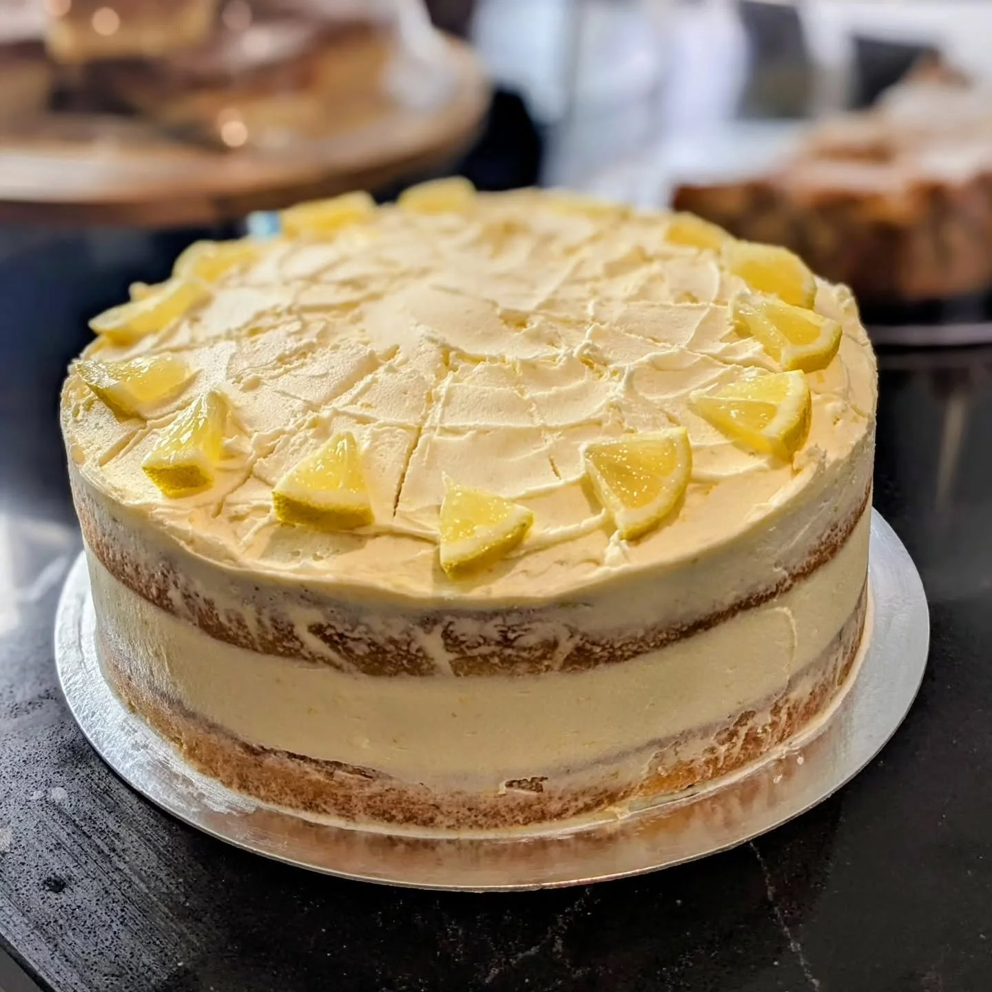 It's our one month birthday! The shop and cafe has been open a month and it's been wonderful to see lots of people through the doors enjoying lunches, drinks and treats with a vineyard view.

Celebrating today with a glorious lemon cake!
Open all wee