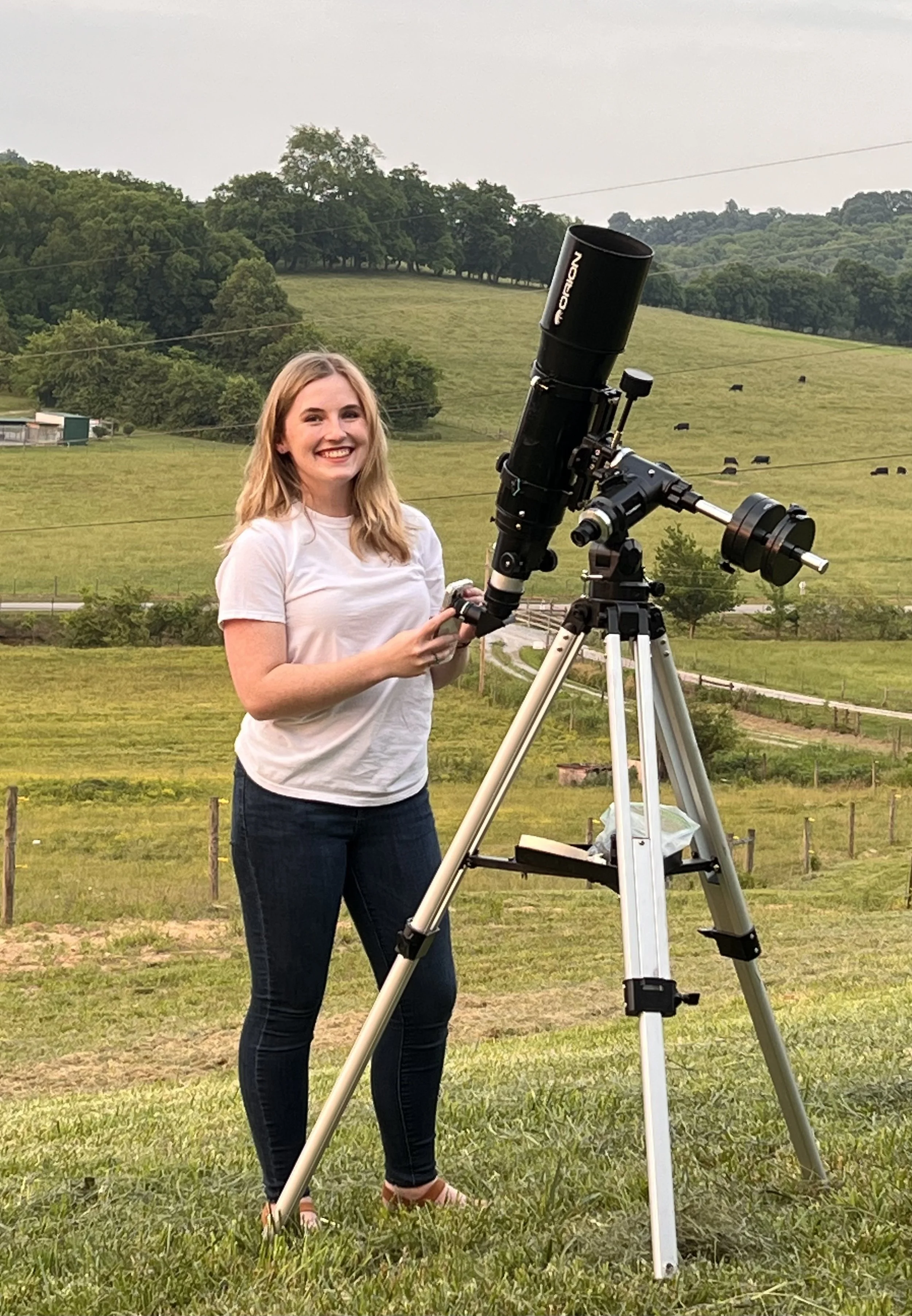 Haley Rice, founder of Project Night Sky, with a telescope in rural Tennessee