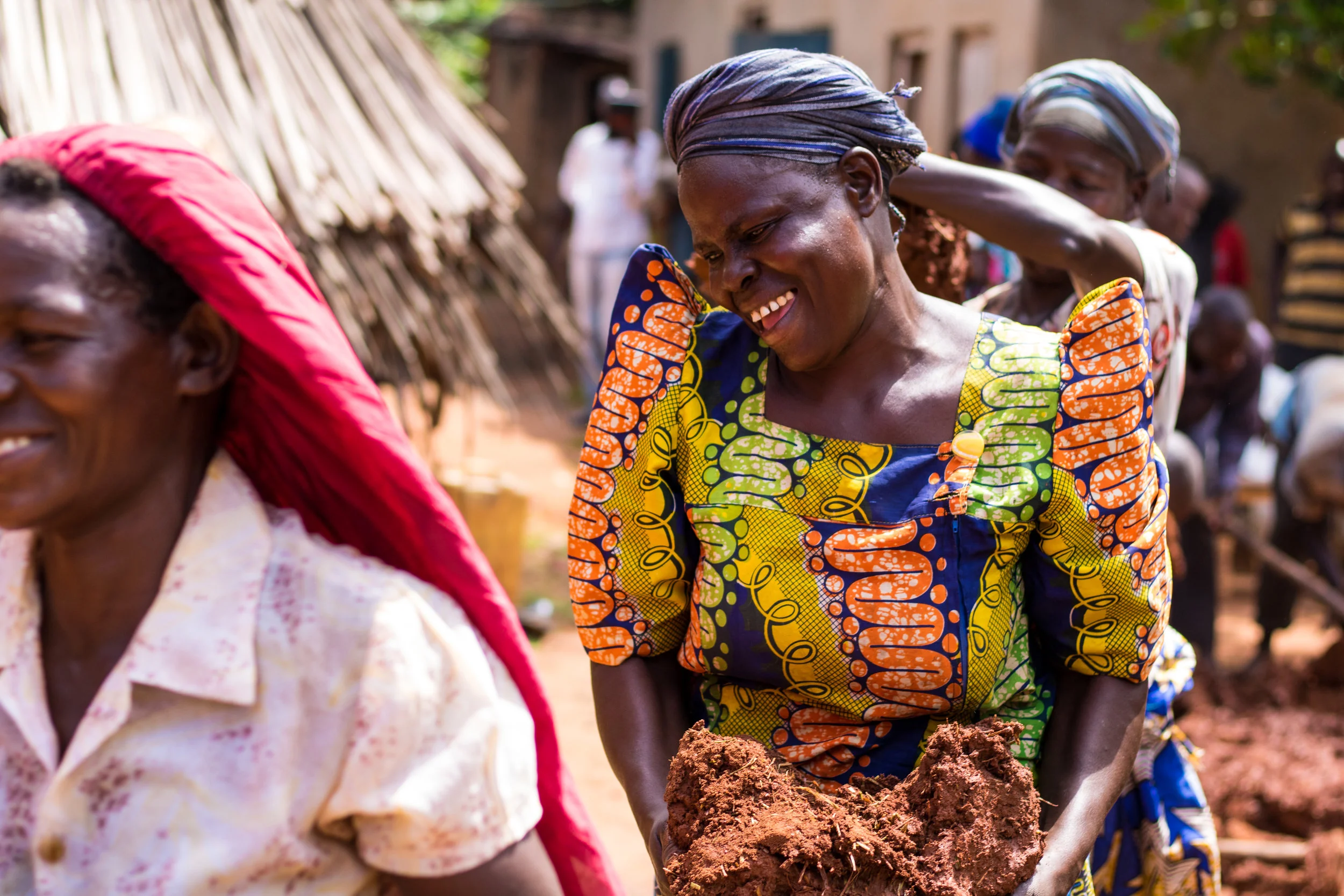 The people of Bulyowa Village work together diligently to build the first two demonstration stoves in their village. Stoves dramatically improve health and safety, especially for women and children.