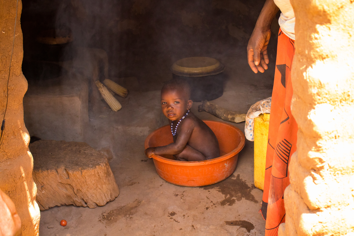  Young children are often in the kitchen with their mothers, since women spend many hours a day preparing food. Open-cooking fires are especially dangerous to children, since children can trip on logs, causing hot pots to spill on them, and smoke-inh