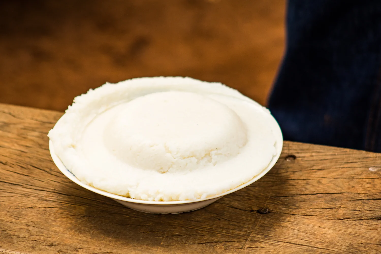 Posho is a common food base in Busoga. It is a white, soft mash made from corn meal. It is usually eaten with hands from a shared bowl.