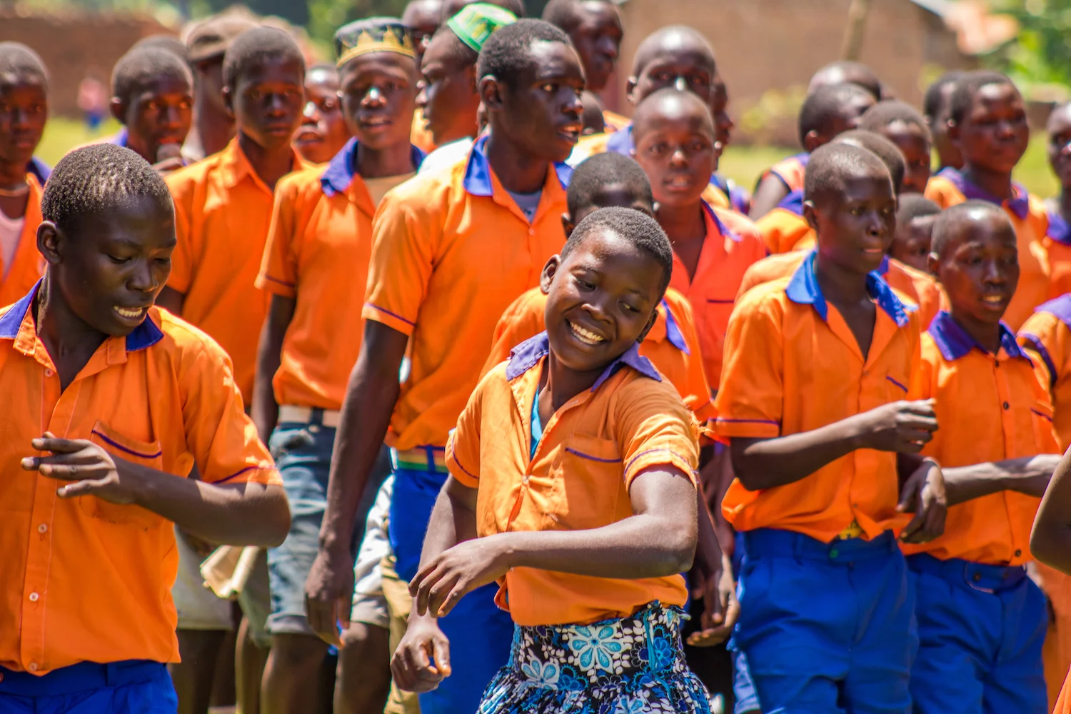 The students of Kivule, where the exhibition was held, welcomed the Kibo staff, their peers from Kigalama, and all of the parents, teachers, administrators, and government officials in attendance with performances they prepared. As they danced in celebration, the students sang of their love for Manuela and Lorna, who invested an hour a week in their personal development during Life Skills classes. The students also expressed their gratitude to Kibo — for selecting their school to receive Life Skills training — and to their parents and teachers for allowing them to attend school.