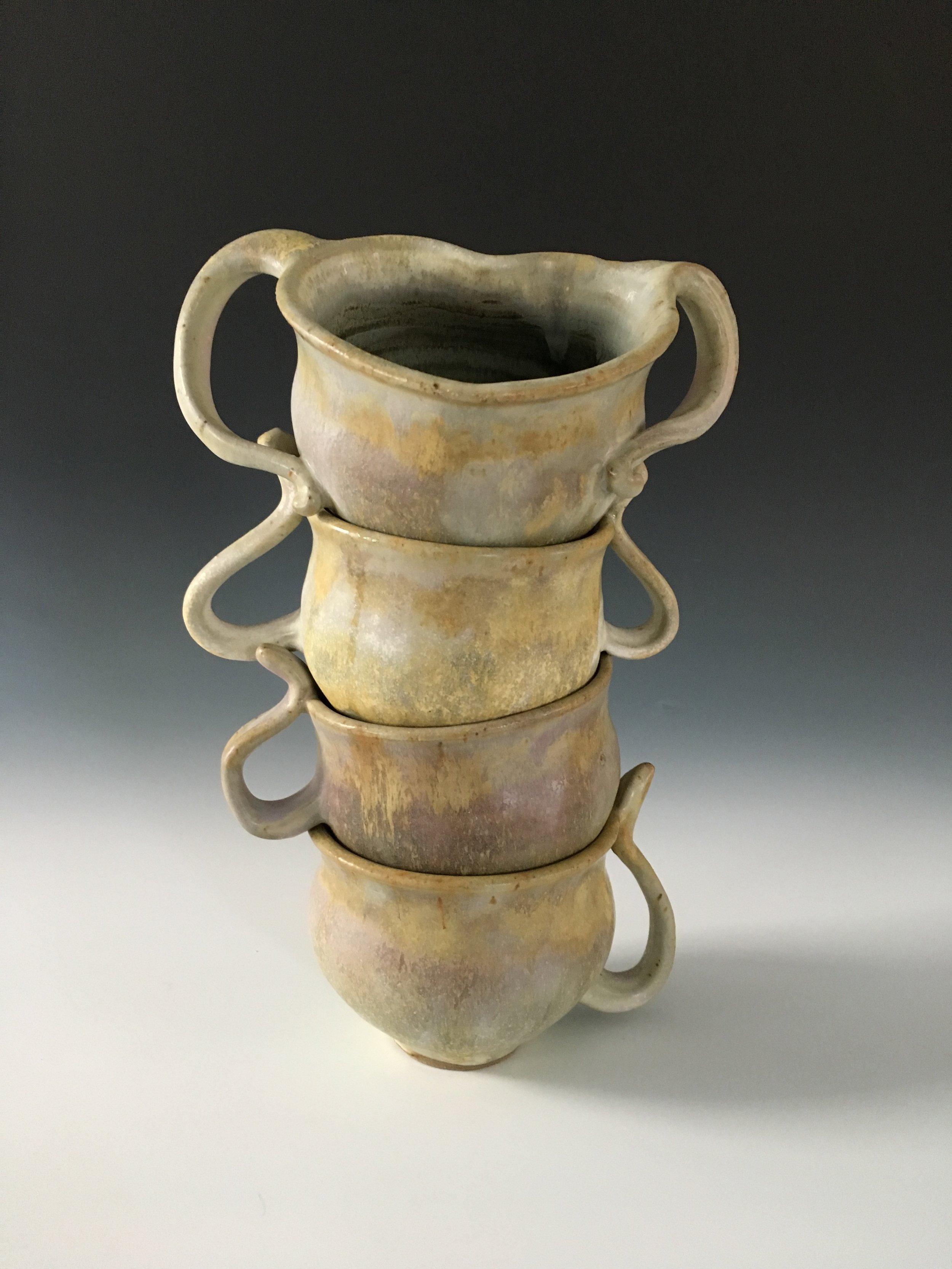  This is my first crack at an idea I've been kicking around for a while.&nbsp; I entered this fun-loving set into my studio's most recent challenge: to create work that explores play in ceramics. 