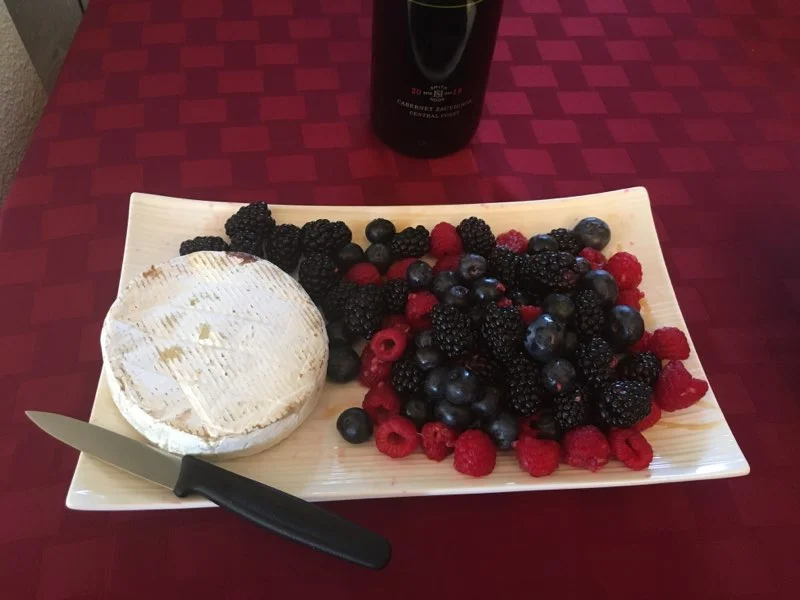 Blueberries, raspberries, blackberries and Camembert cheese