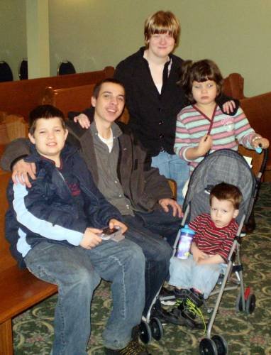 Me with my siblings my step brother is the only sibling with out 22q and the little one in the stroller he lived until he was 6 years old. The other two are alive and doing well like Bella and I are.