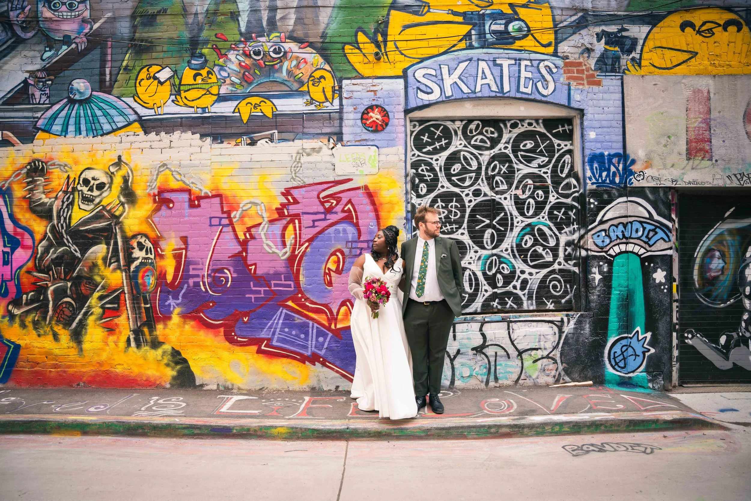 Wedding photography at the graffiti alley on Queen Street West in Toronto Ontario.