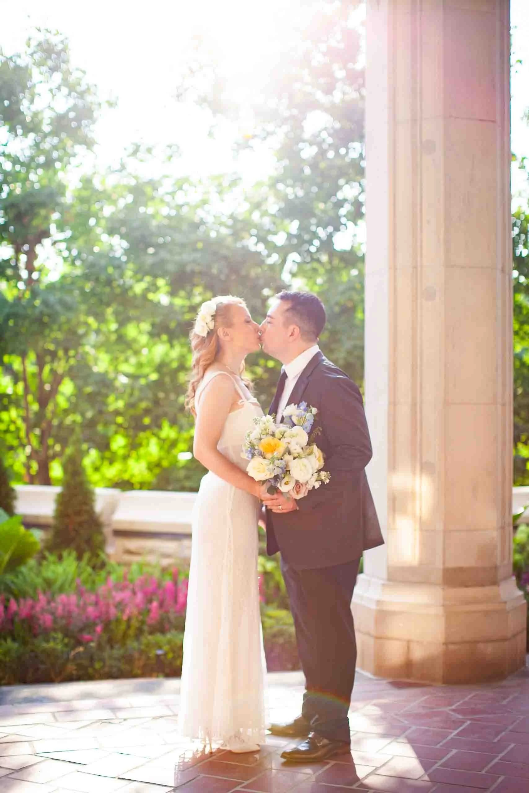 Bride and groom posing for their wedding photo at Casa Loma Toronto