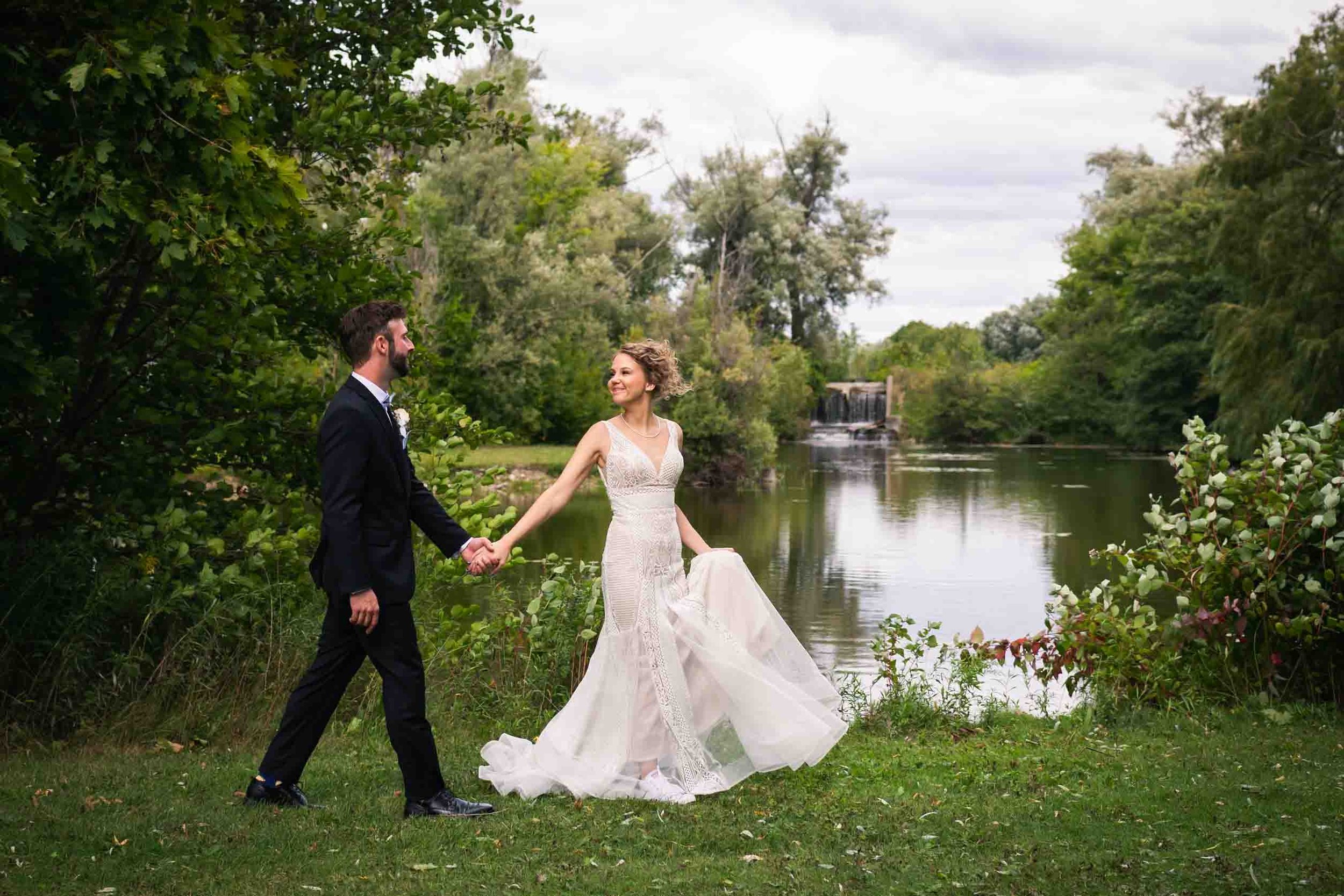 Couple walking along the pond for their wedding photography photoshoot in toronto ontario.