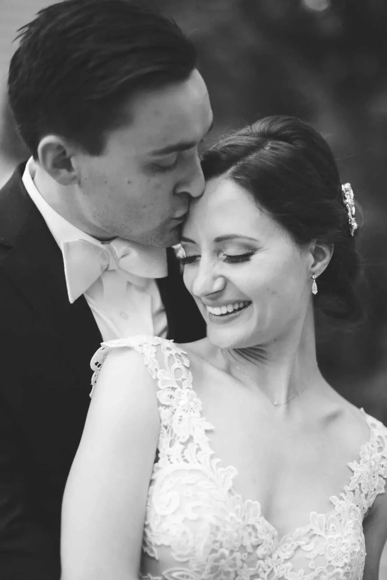 Black and White Wedding Portrait at The Doctor’s House – Groom Kissing Bride’s Forehead