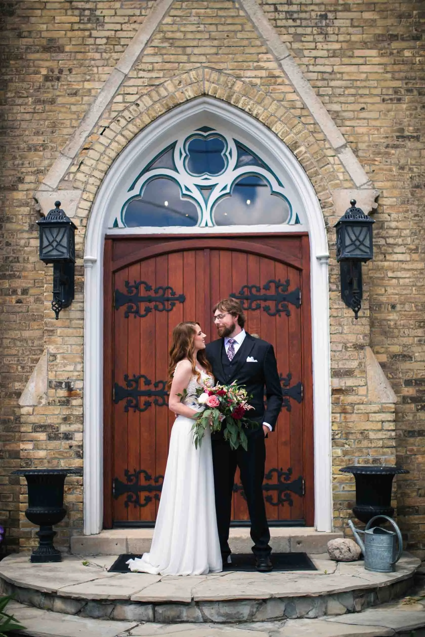 Bride and groom in front of Hauser Hall