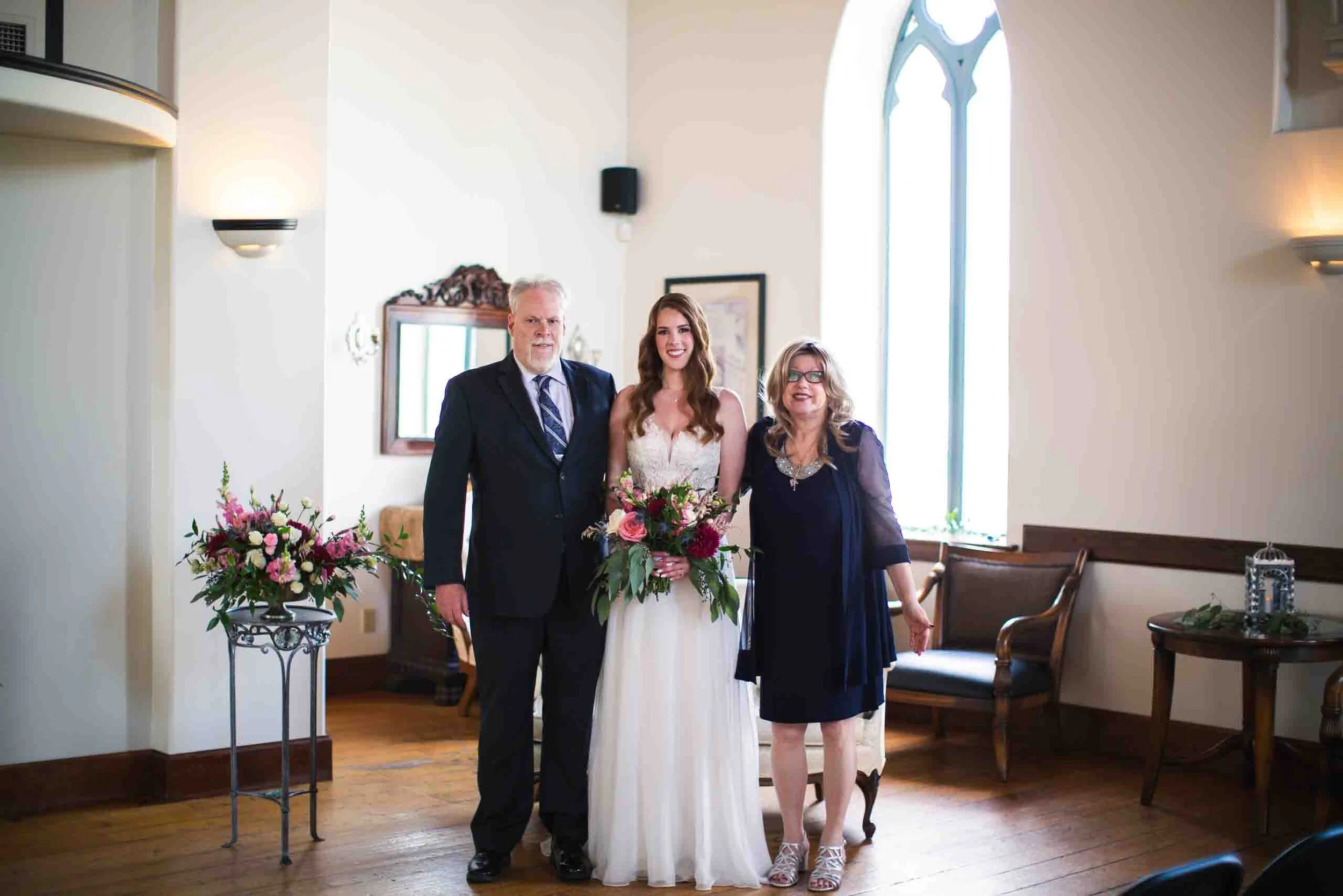 Bride with her parents at Hauser Hall