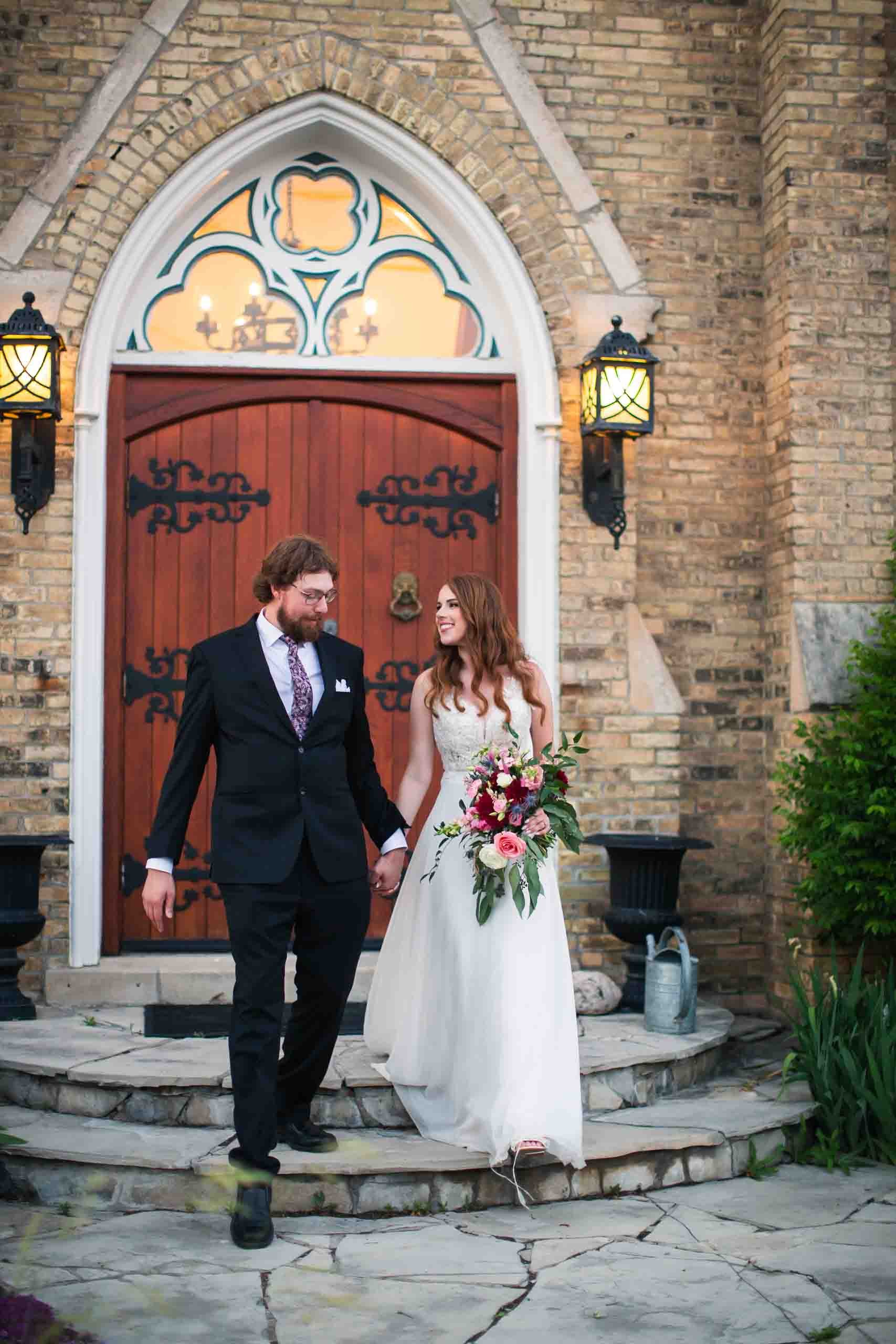 Bride and groom portraits in front of Hauser Hall