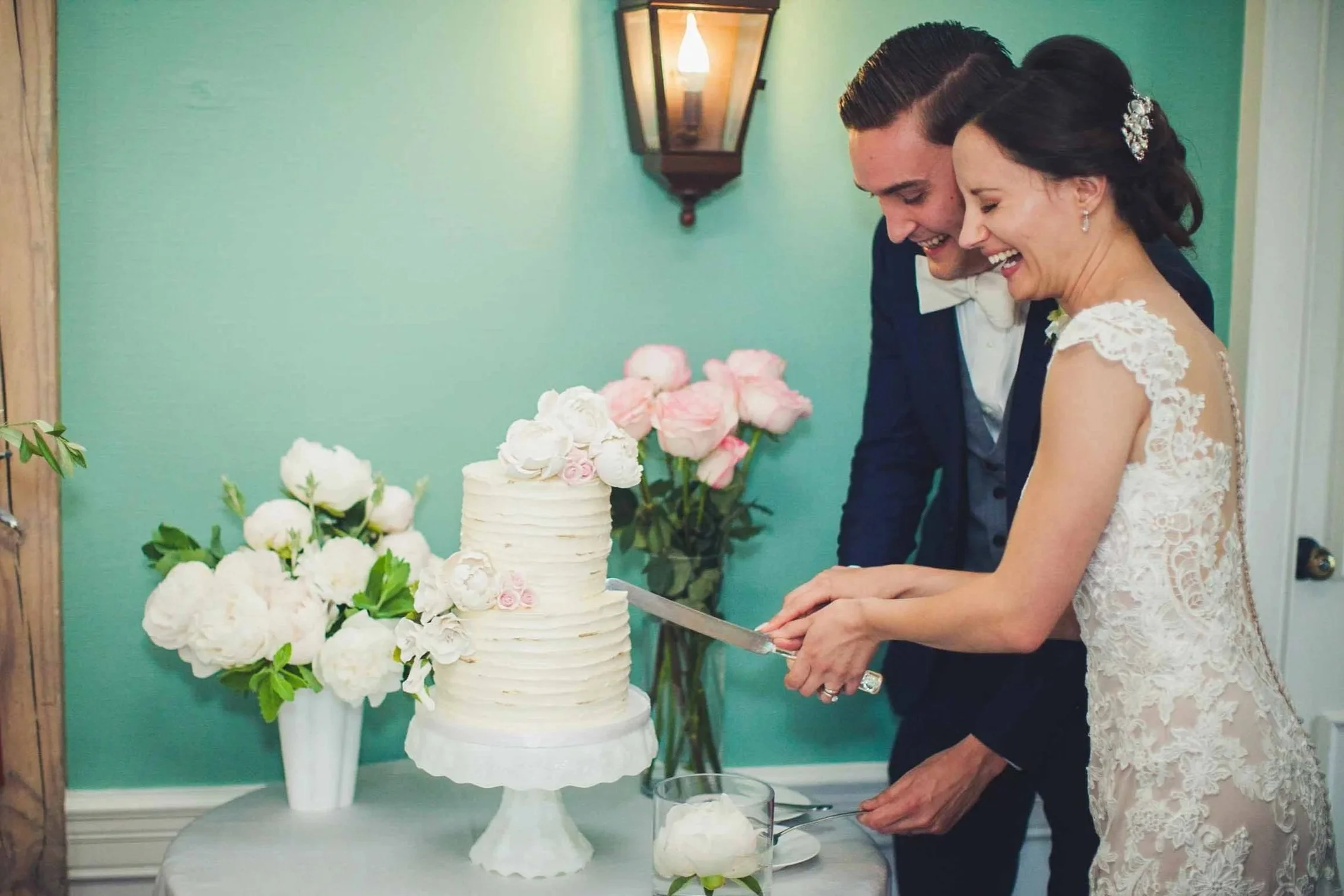 Bride and groom cutting cake affordable wedding photography in guelph and cambridge area.