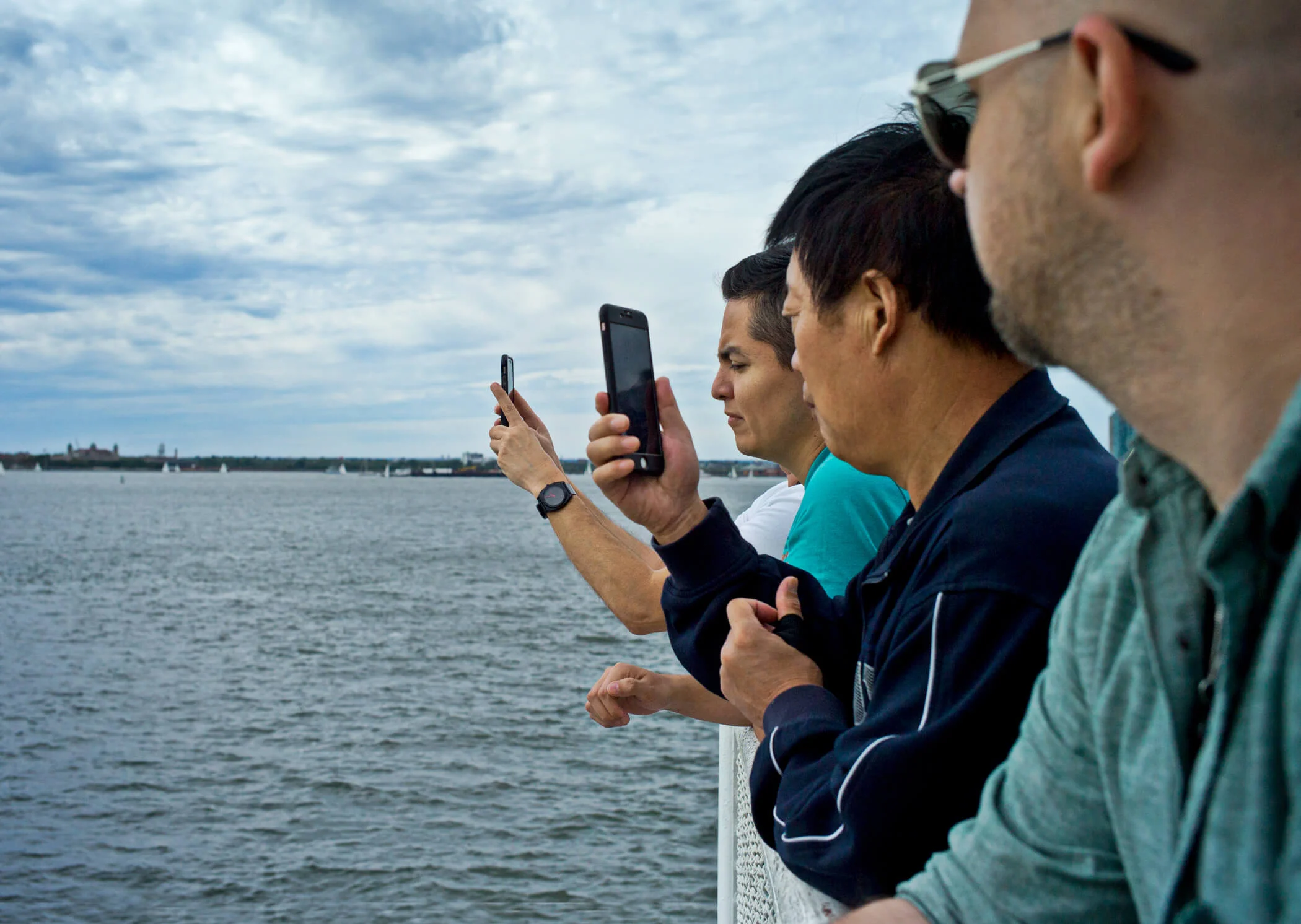 Men Facing Their Cell Phones