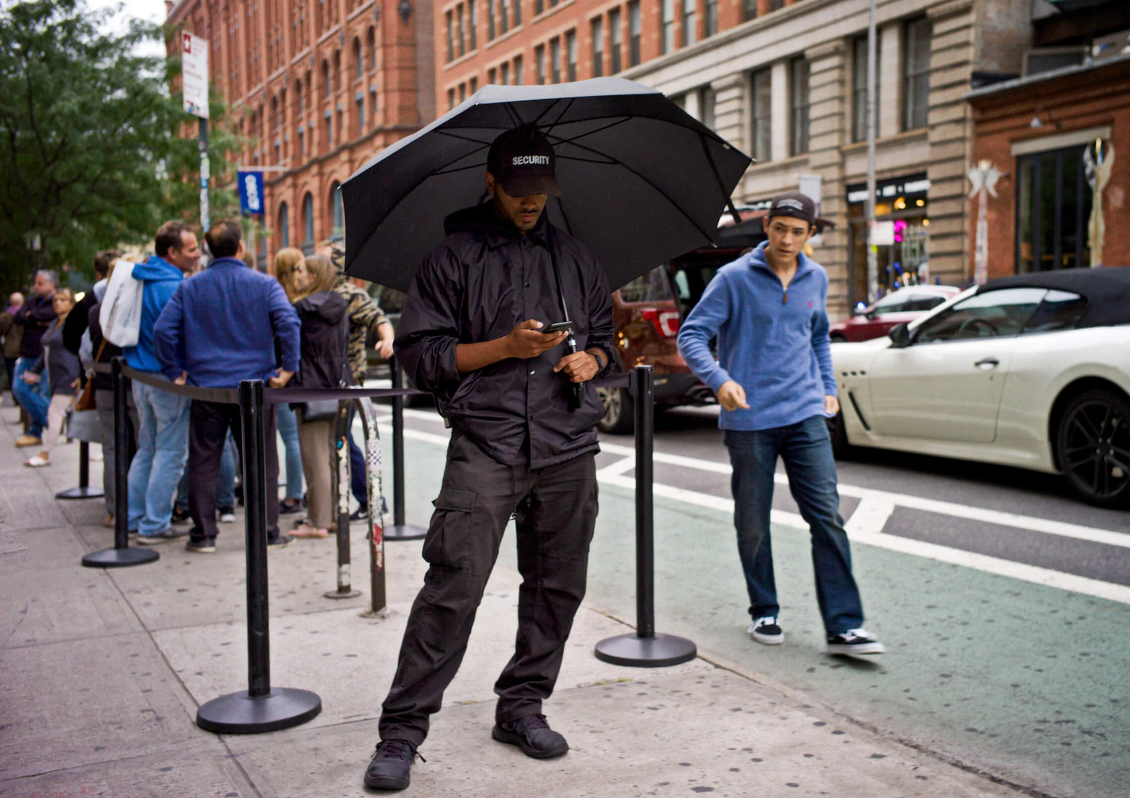 Security Guy Checking His Phone