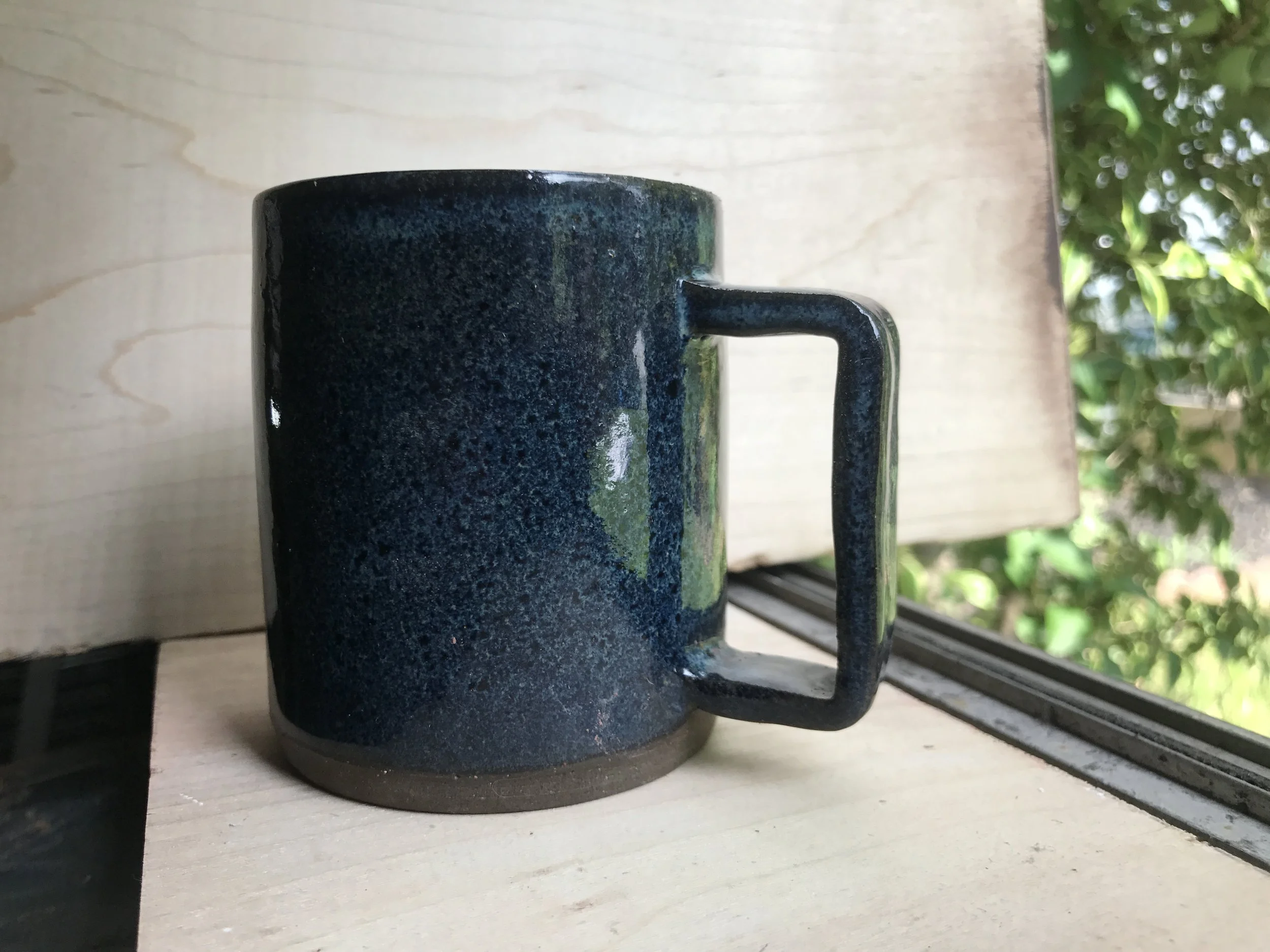 Small mug w/speckled blue glaze