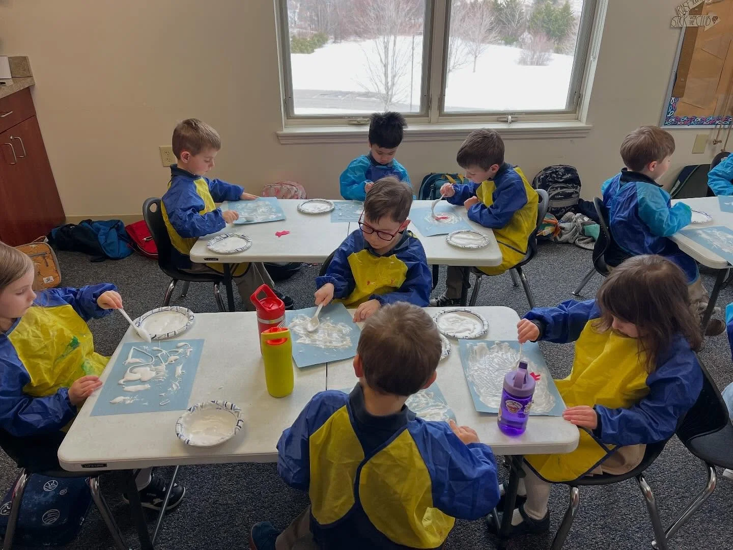 Our Pre-K class had the perfect life/school overlap when their World Discovery book &ldquo;The Snowy Day&rdquo; coincided with what were maaaany snowy days in Blacksburg! Look at the backdrop outside their classroom window as they made their snowy cr