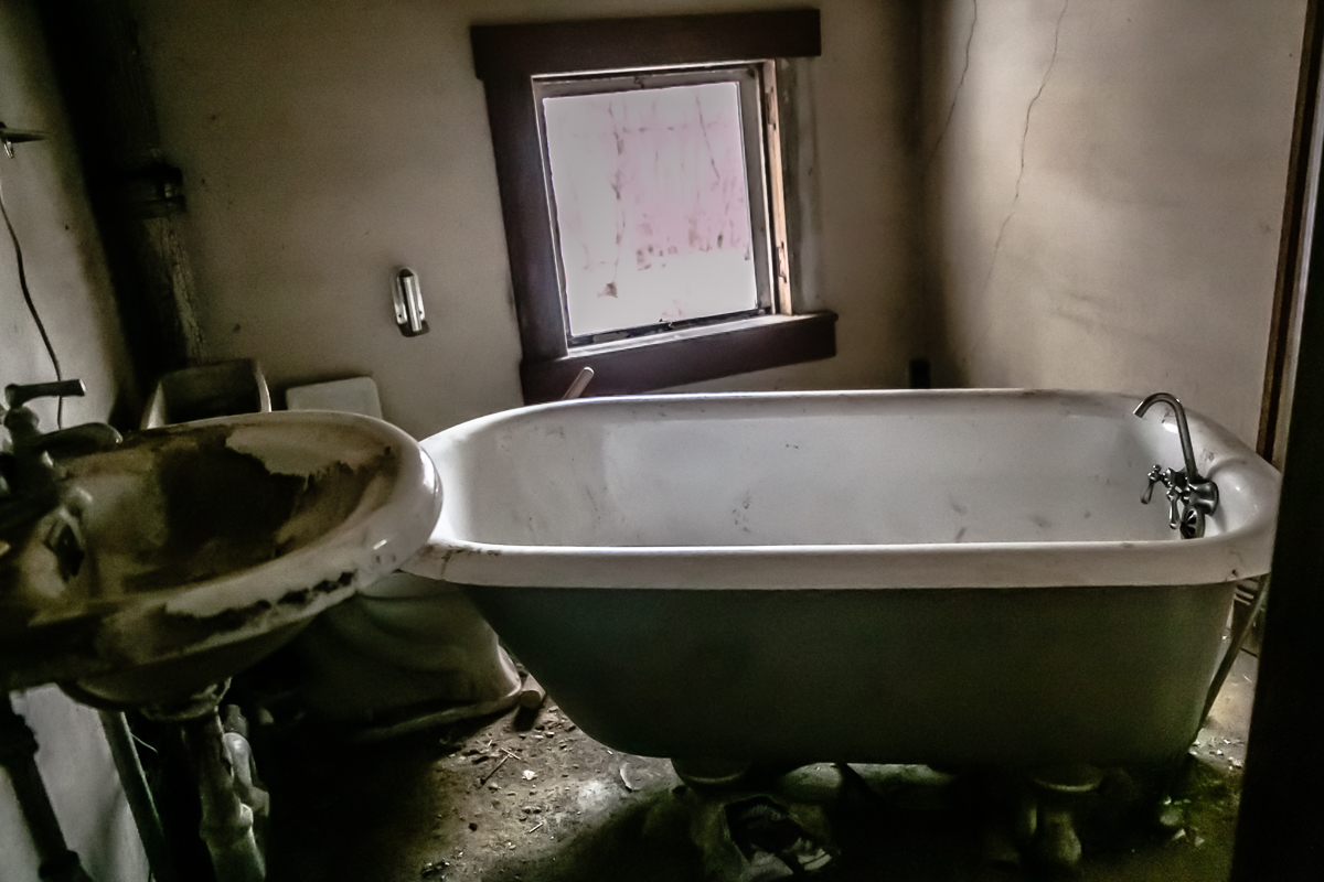 Now THIS was exciting. Do you know how long Sam and I have been looking for a real claw foot bathtub in an abandoned place that we could use for a shoot? FOREVER. This has been on our list of ideas for a long time, AND it is not really too dirty at all! 