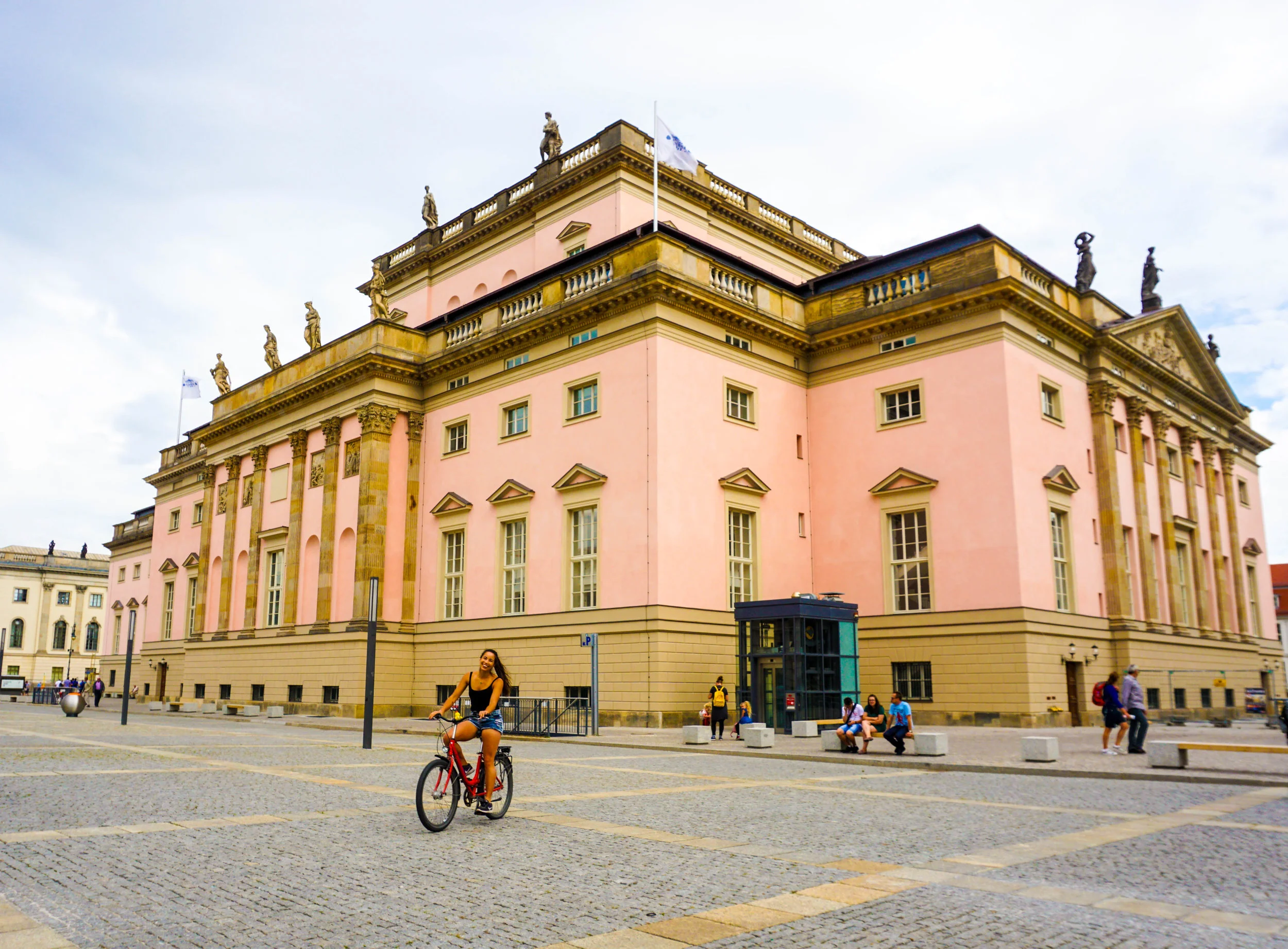 Biking in front of the Berlin State Opera House