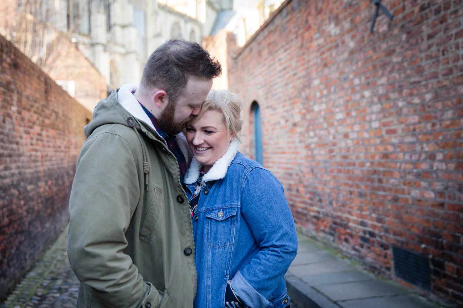 When the alarm clock went off at 6am, I was cursing myself for having suggested another dawn shoot on a Sunday! However, it was totally worth the early start to meet up with Kim and Adam for their pre-wedding shoot around the streets of York. After all, there aren’t many times when you get The Shambles to yourself. So it was that without a tourist in sight we took a tour of York’s historic sights, starting at the city’s most famous street with it’s overhanging timber-framed buildings. We then moved onto the Minster and got some shots in front of what must be the best doors in Yorkshire, before finishing at the city walls (once we’d found a gate that was open!) and a chance to take the chill off in the early morning sunshine. The other advantage of an early morning shoot is that after all that hard work, there is only one way to finish a pre-wedding shoot and that’s with with a nice cup of Yorkshire tea and a bacon buttie! I really enjoyed getting to know Kim and Adam. They are so easy going and up for everything I suggested, which makes my job so easy and such a pleasure. I hope they enjoyed the shoot as much as I did. I came away from meeting these guys with a bounce in my step and feeling totally re-energized for the day ahead - Sunday lie-ins are over-rated! 