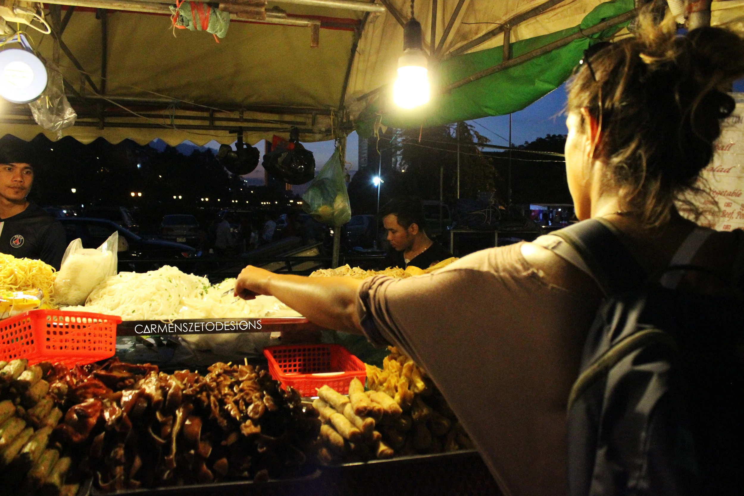 Night food market in Phnom Penh, Cambodia highlighting the cow intestine, spring rolls and noodles we ate!
