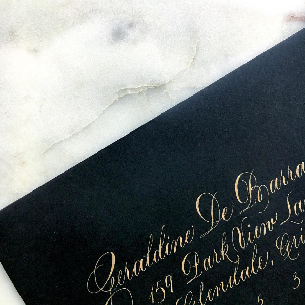 luna gold on black envelope.png