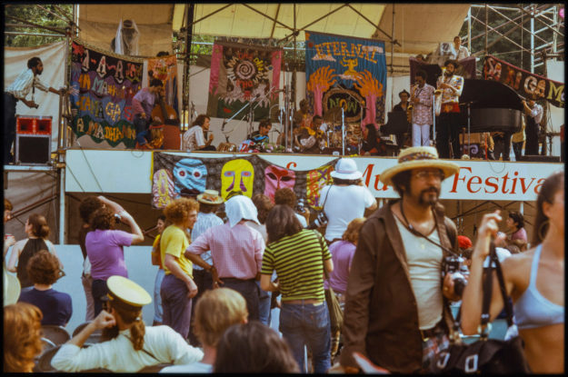 Organic Music performance, with Eternal Now hung in the background on the right.