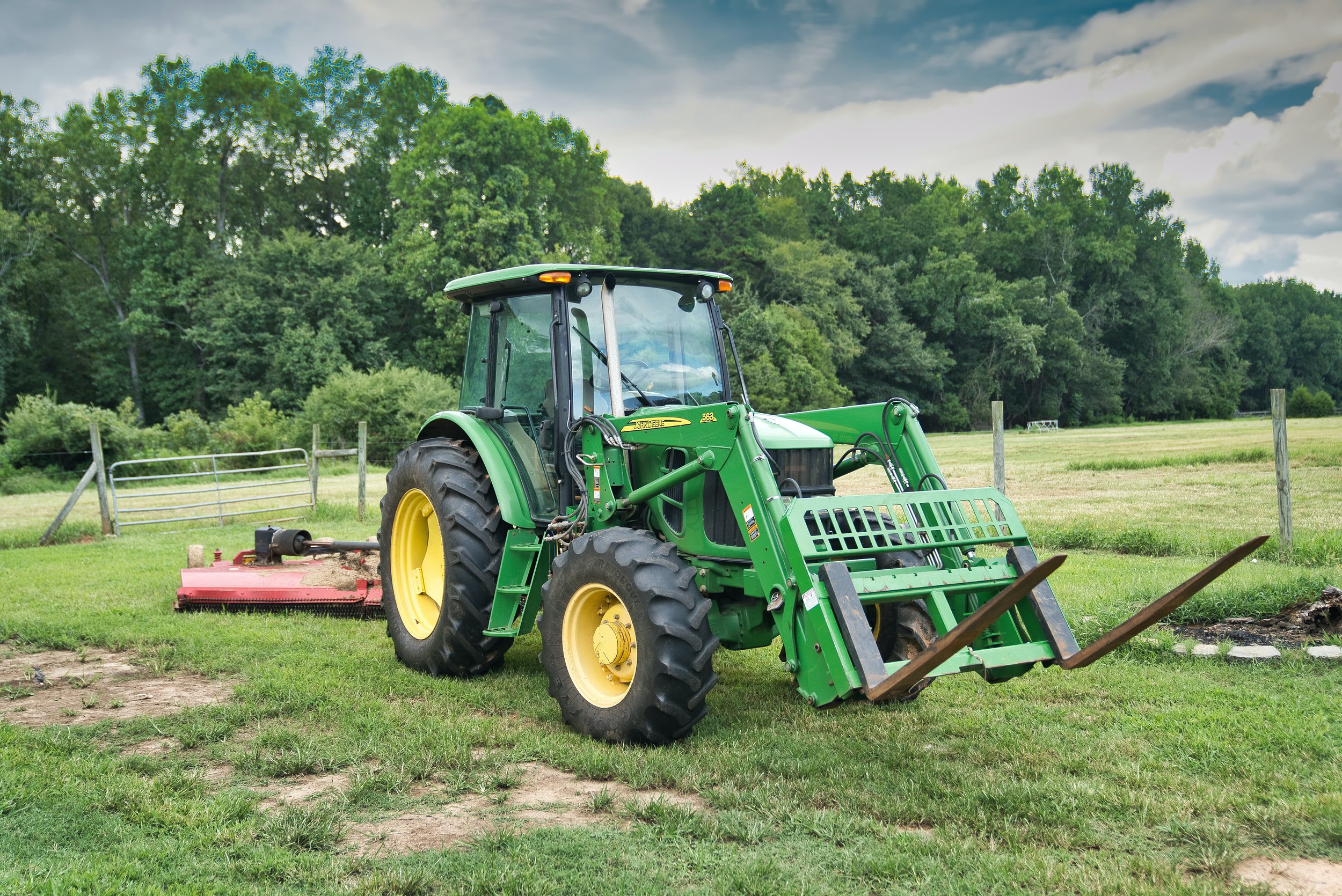 tractor mowing the backyard