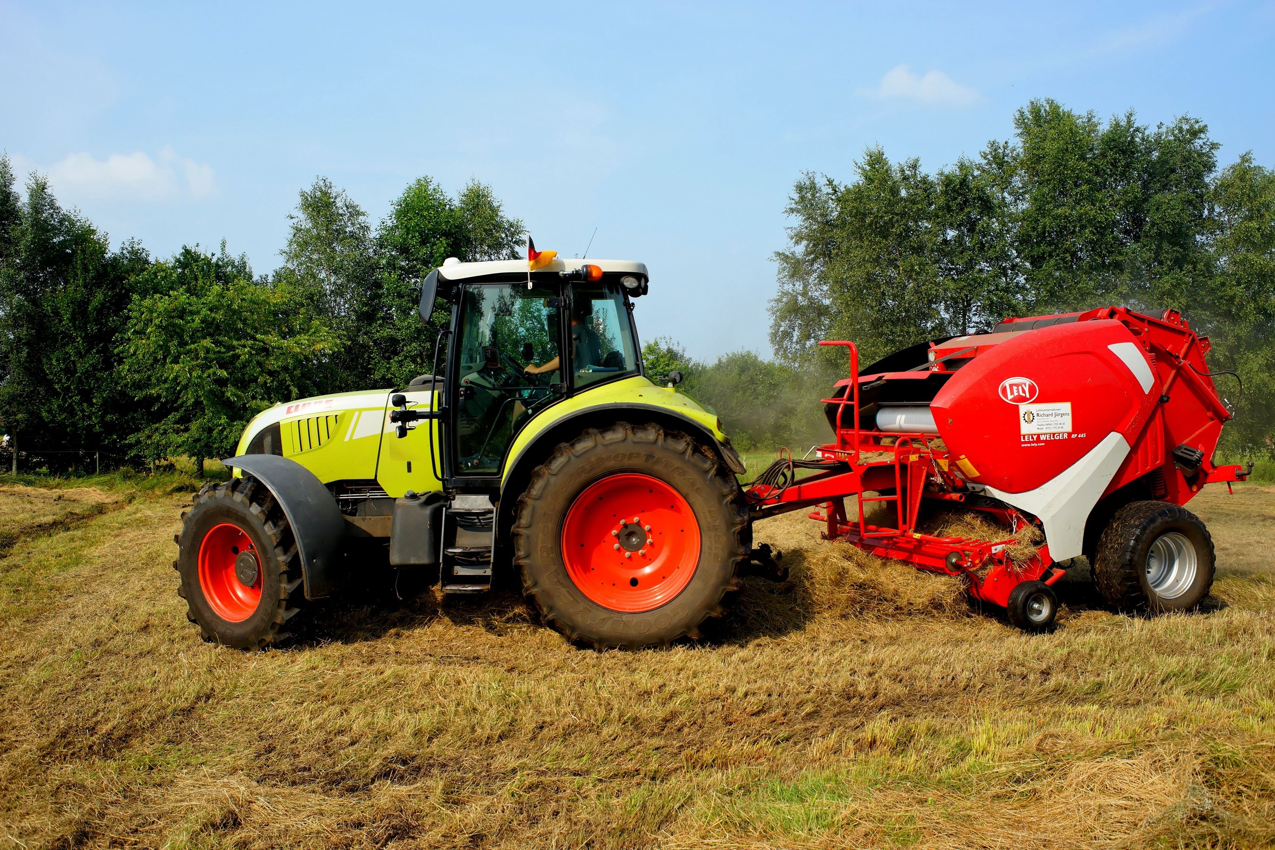 tractor with heavy equipment attached at the back