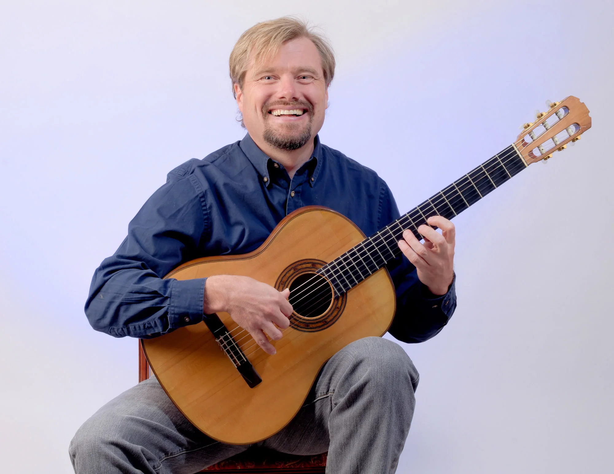 Jamie is originally from Queensland, Australia, but holds American as well as Australian citizenship. He can conduct a chorus, do a solo gig with a guitar for a bunch of drunks in a bar, play the piano, play folk, rock and classical guitar, and I don't know what all else. He also paints. 