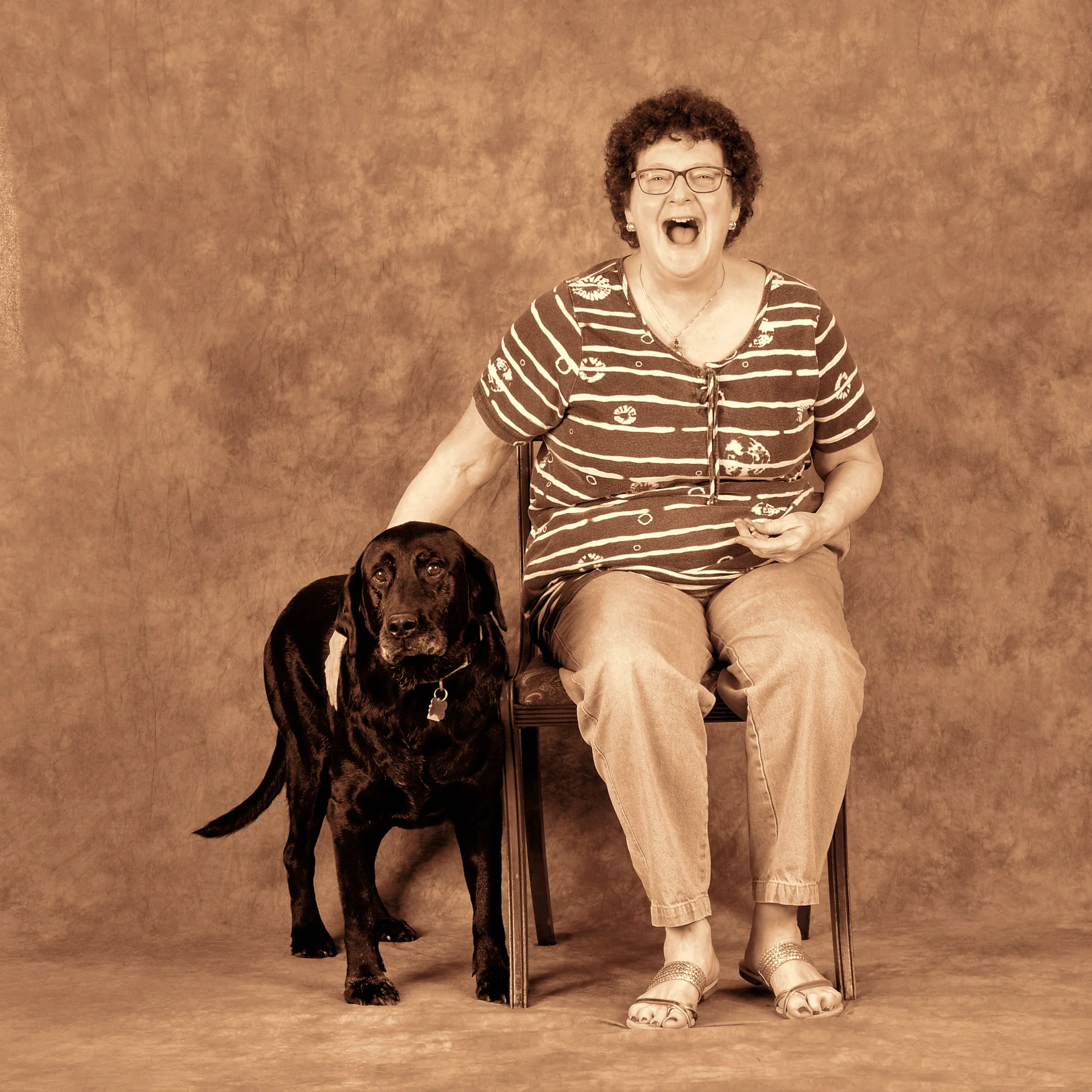 Allyson is having a great time. The dog is afraid of strobe lights and is about to leave the frame.