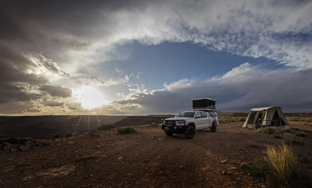 Beautiful sunset with redrock cliffs in the background from the campsite at Gooseneck State Park in southern Utah.