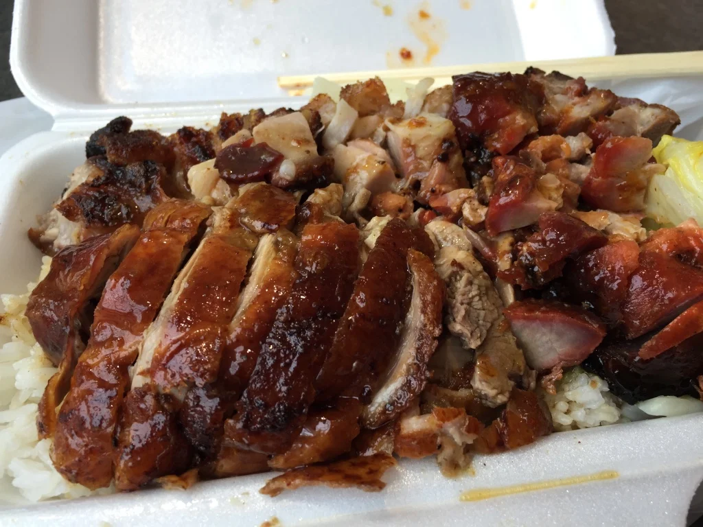 Roast Duck, Roast Pork, and BBQ Pork On Top Of Rice