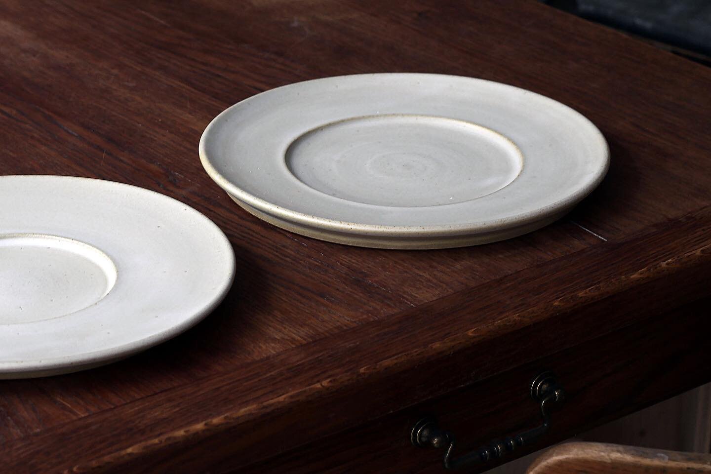 Wheelthrown flat plates with a large rim, 26cm.