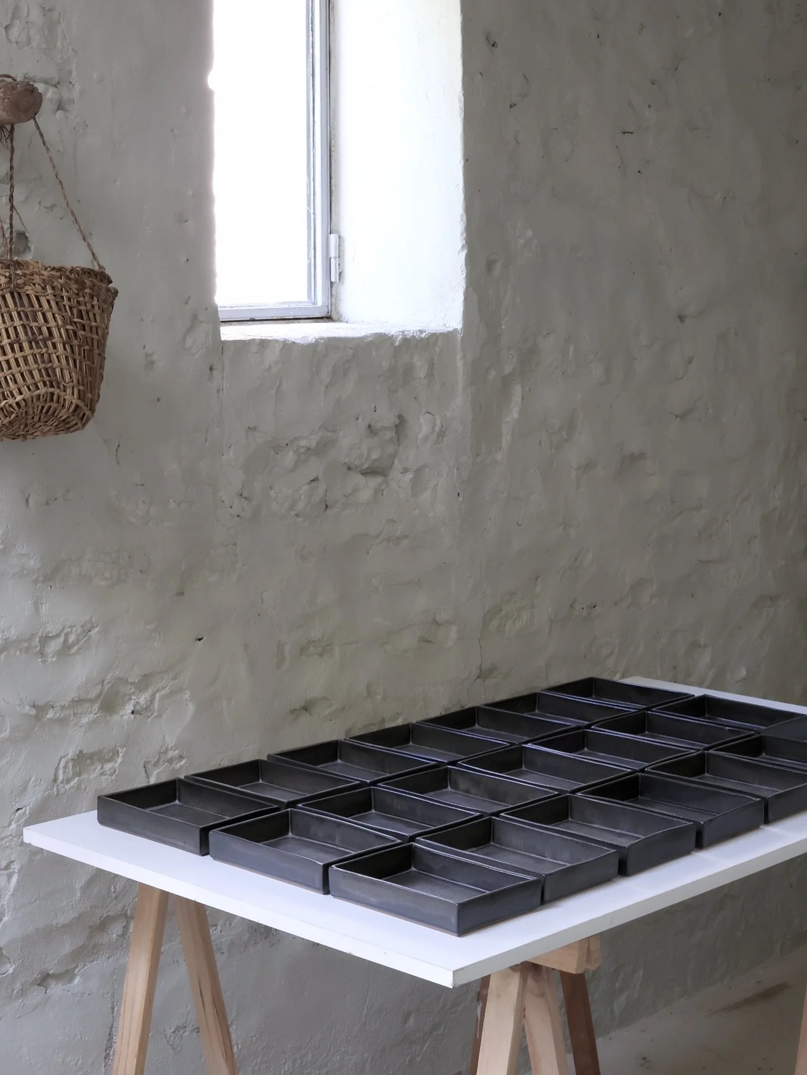 Boxlike dark grey plates for @27quatre omasake restaurant in Paris.