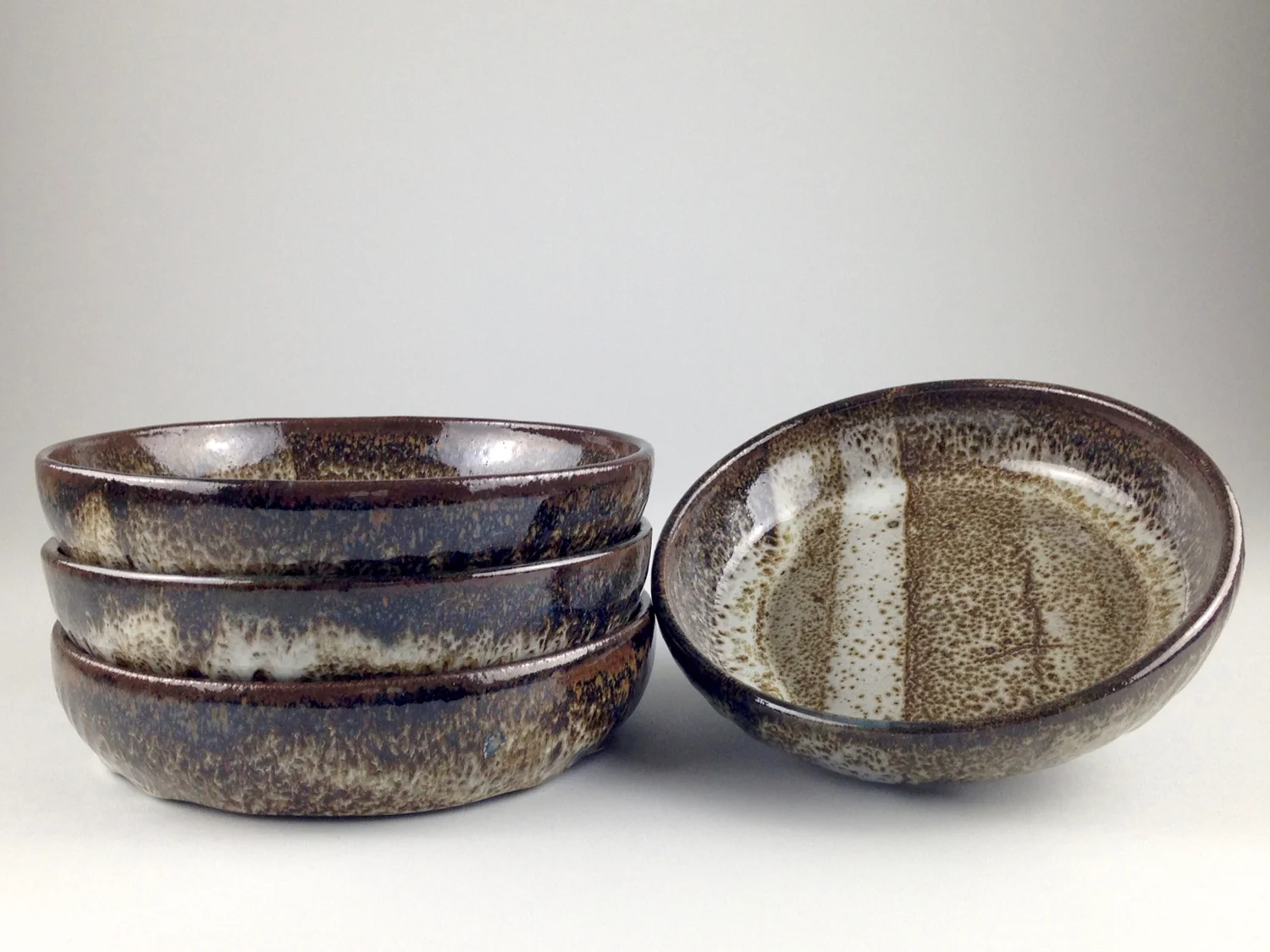 Set of 4 stoneware, faux oil spot bowls
