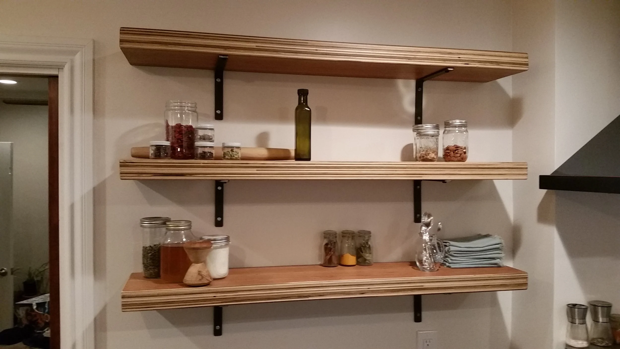 Cherry plywood kitchen shelves.